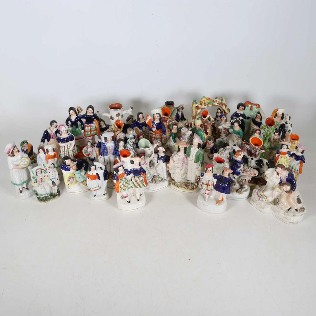 Lot 127 - A collection of Staffordshire figures, to
