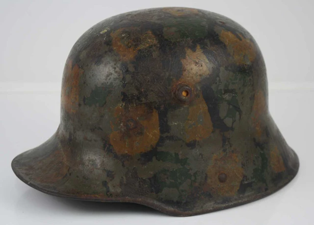 Lot 1176 - A German M16 stalhelm, having painted