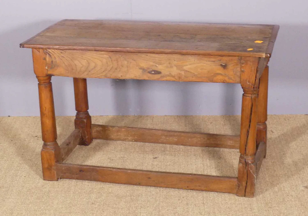 Lot 652 - An antique joined oak and elm low