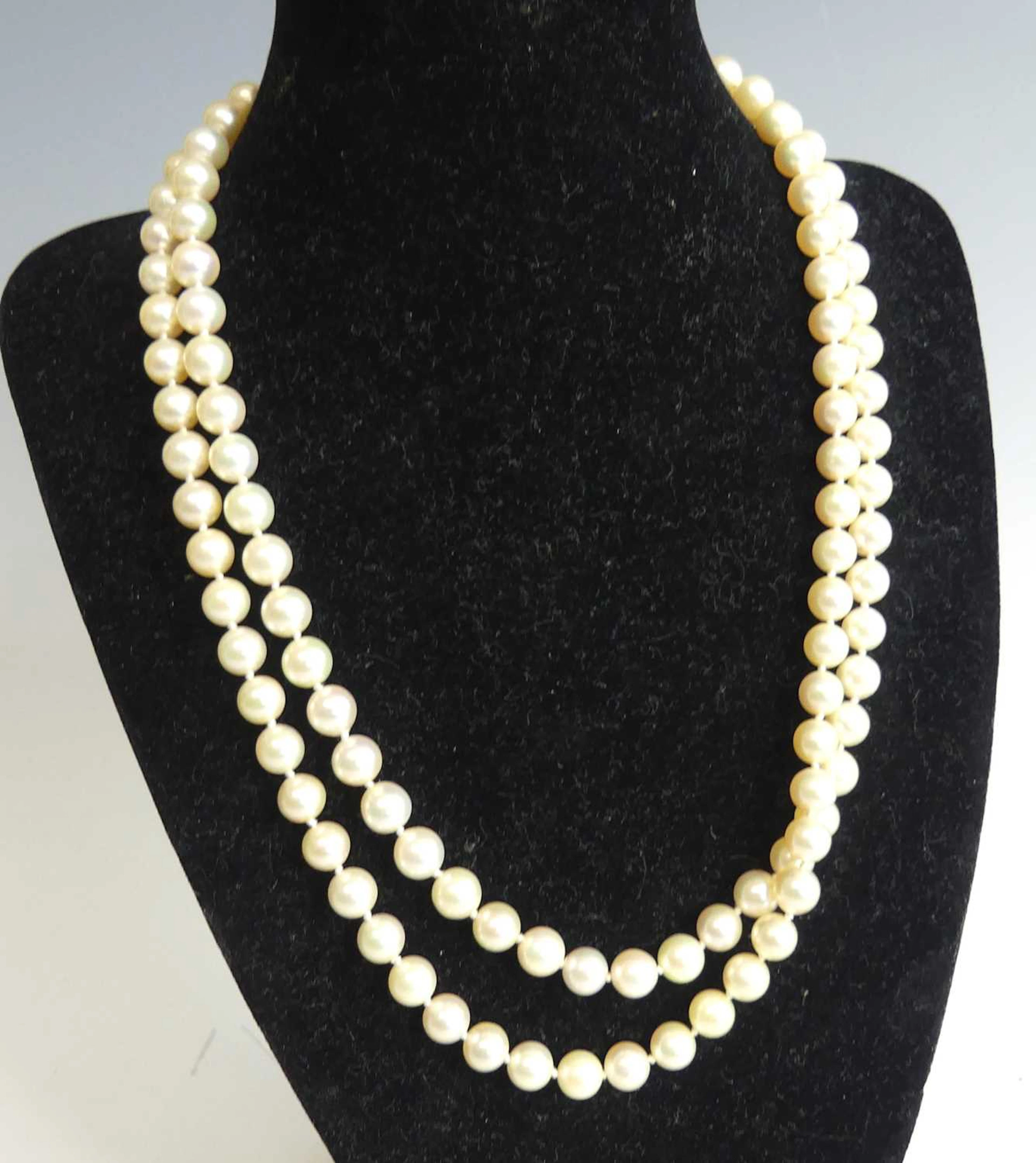 Lot 2246 - A two-row necklace of 58 and 54 uniform