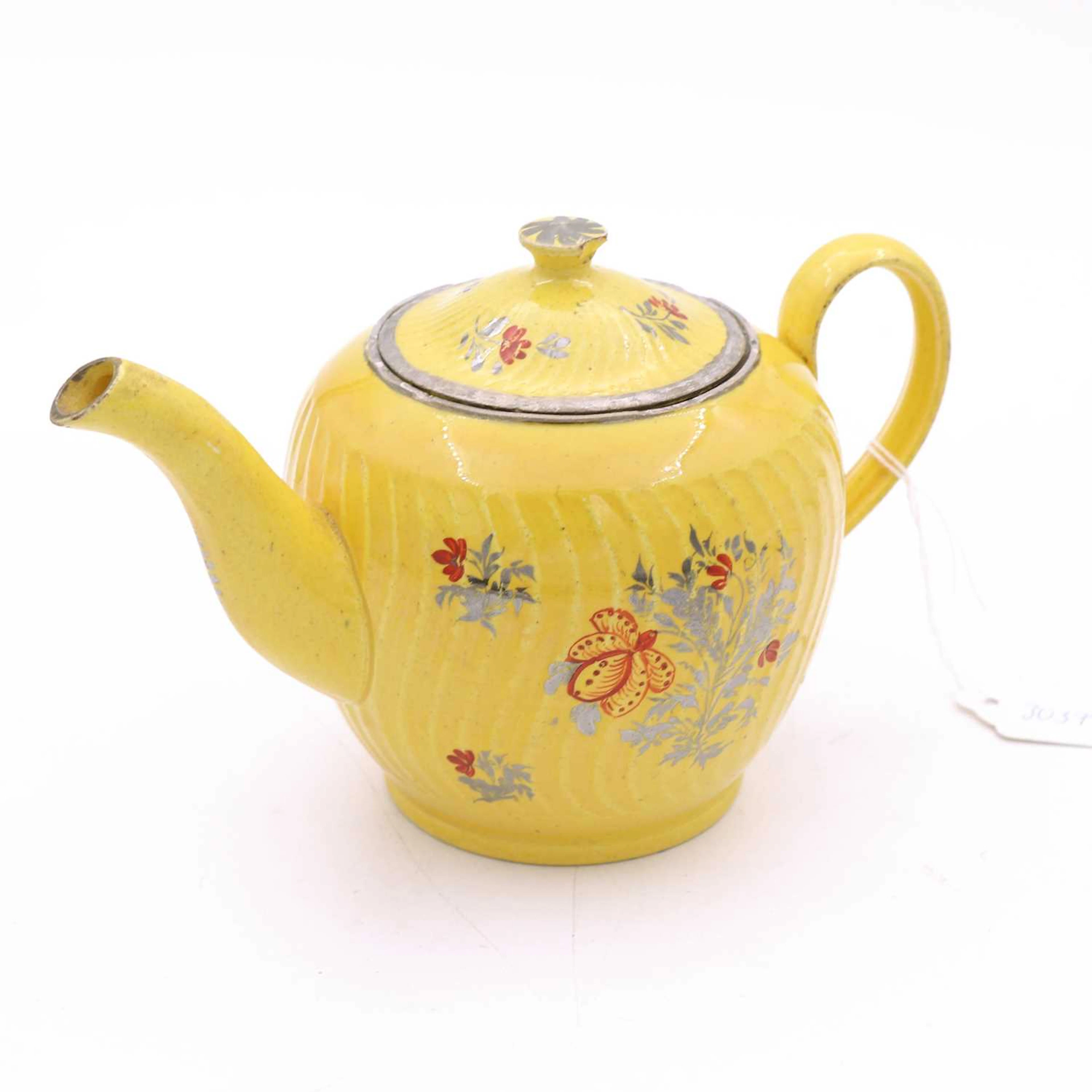Lot 104 - A Staffordshire yellow ware teapot, circa