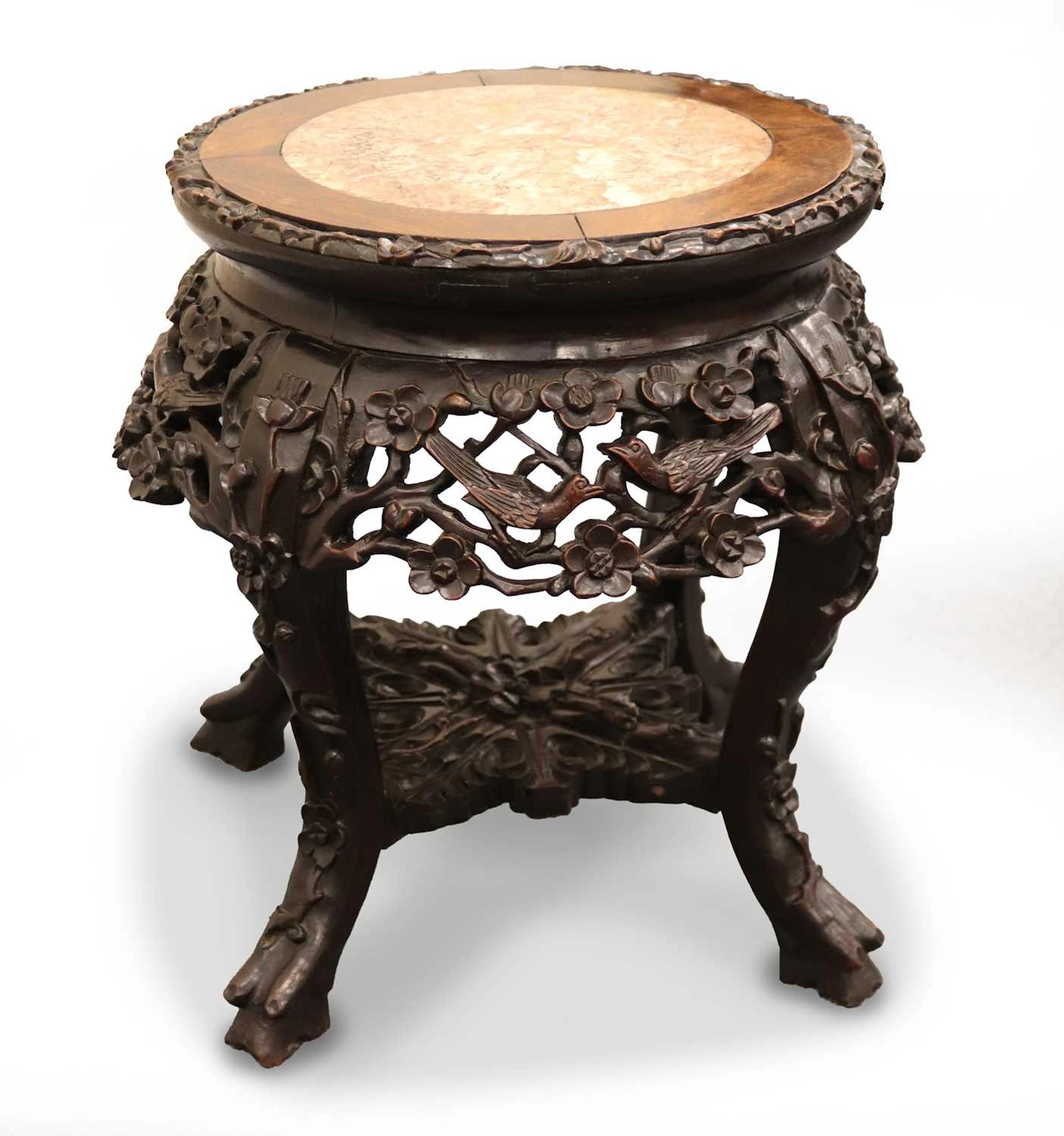 Lot 179 - A Chinese carved hardwood stool with inset