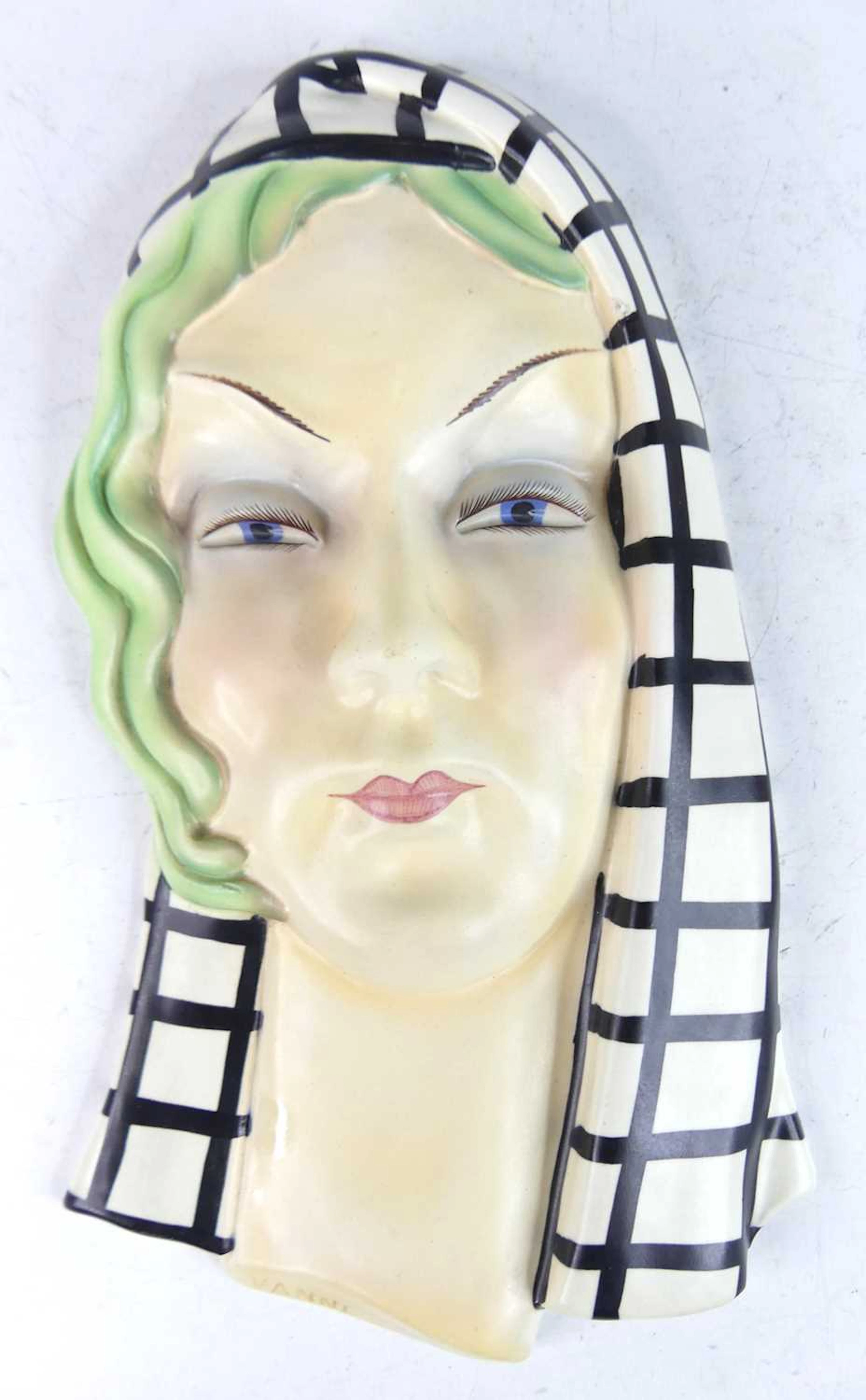 Lot 24 - An Italian pottery wall mask, modelled as a