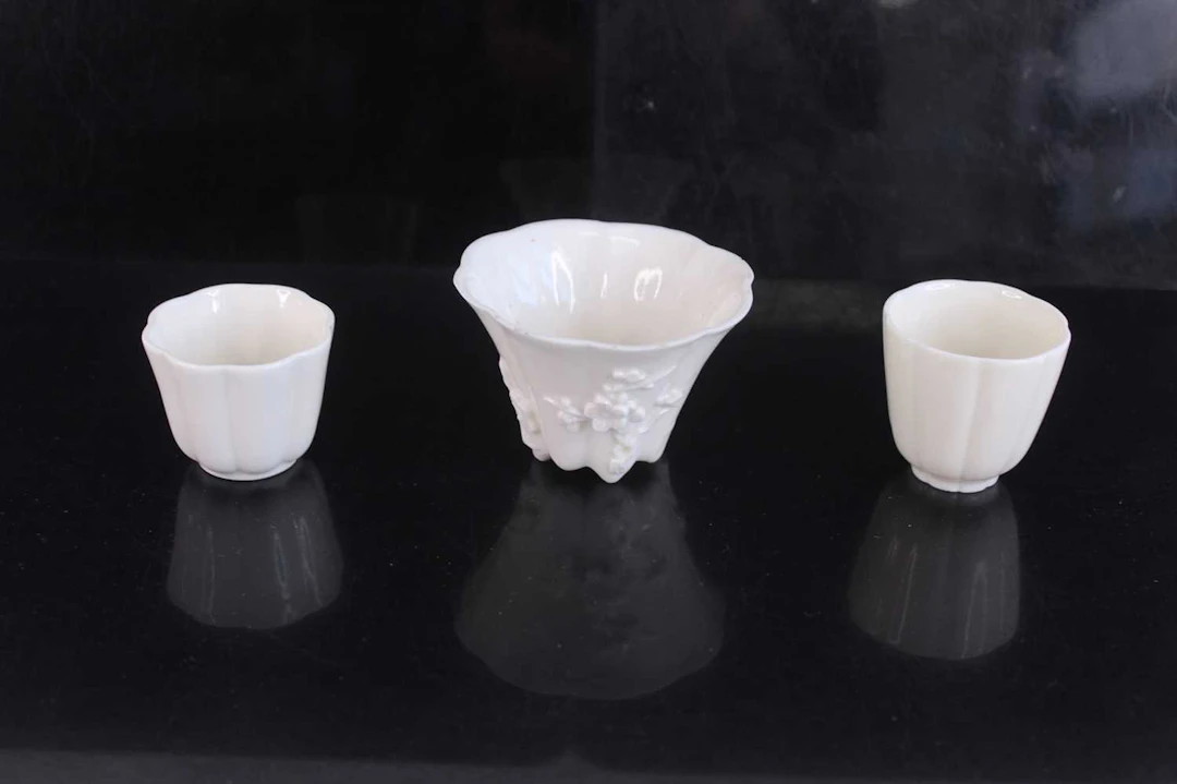 Lot 49 - Three Chinese Dehua blanc-de-Chine cups, Qing