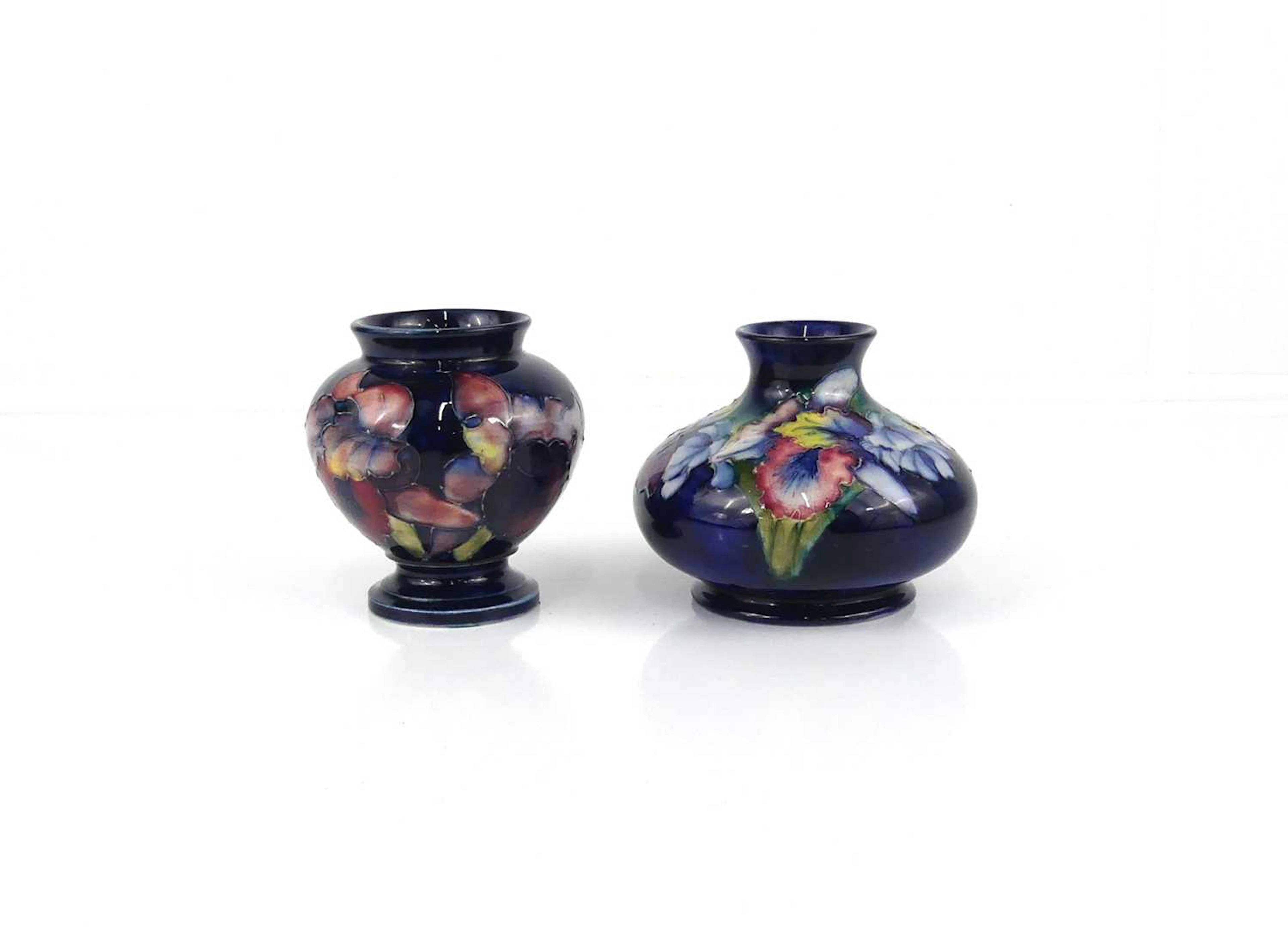 Lot 236 - A Moorcroft Iris pattern pottery small squat