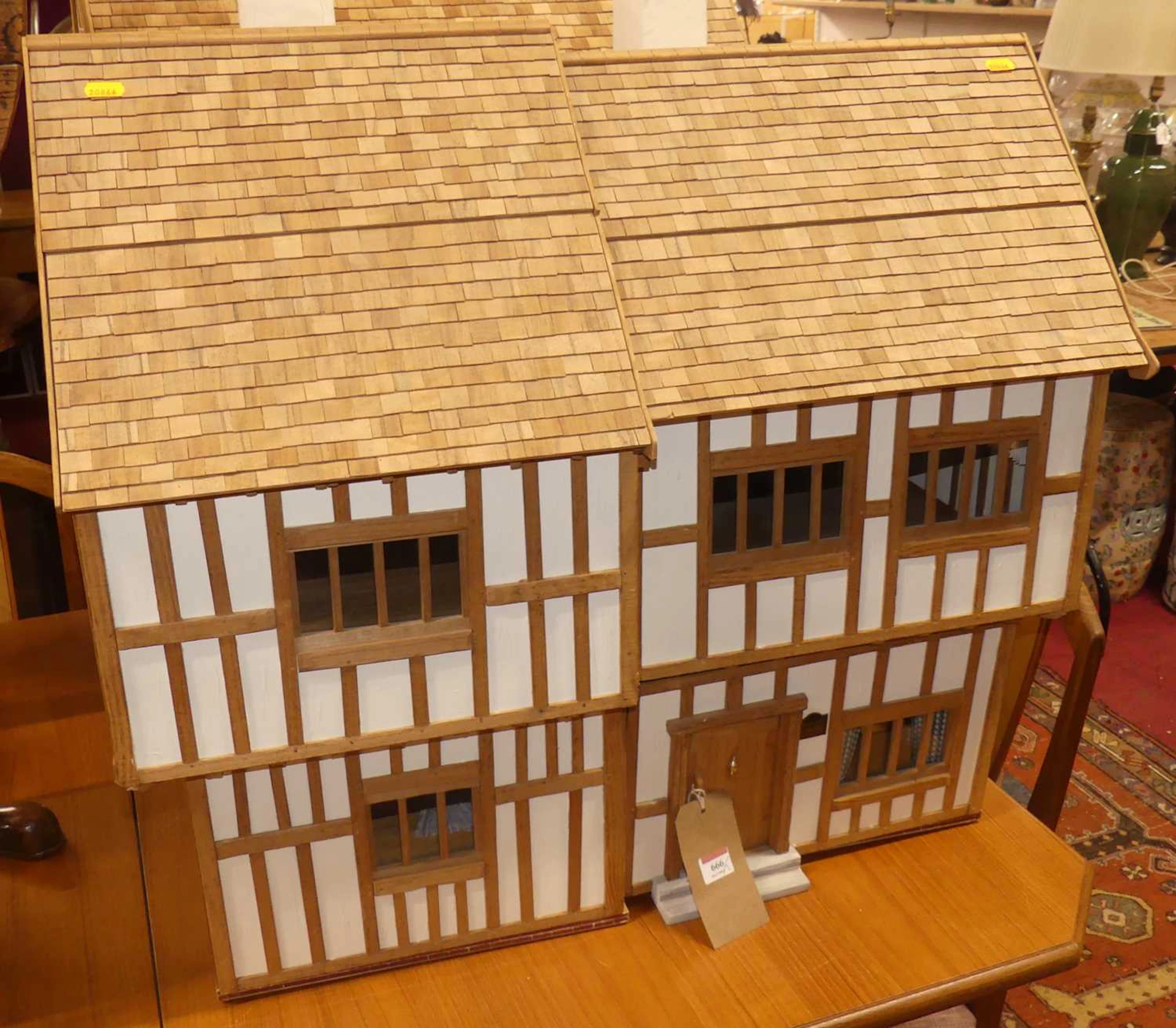 Lot 666 - Two doll houses in the Tudor taste, the