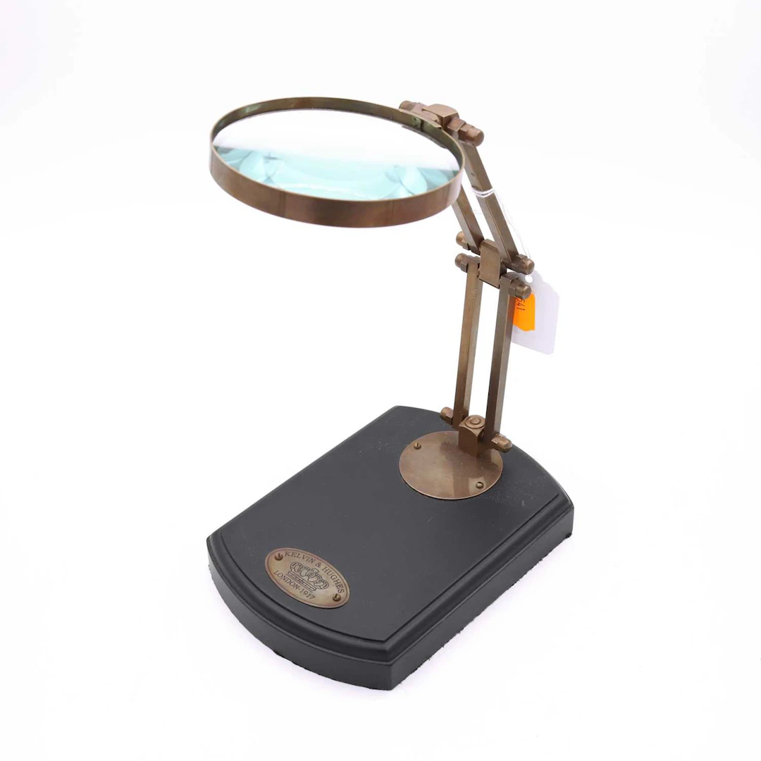 Lot 34 - A reproduction table-top magnifying glass