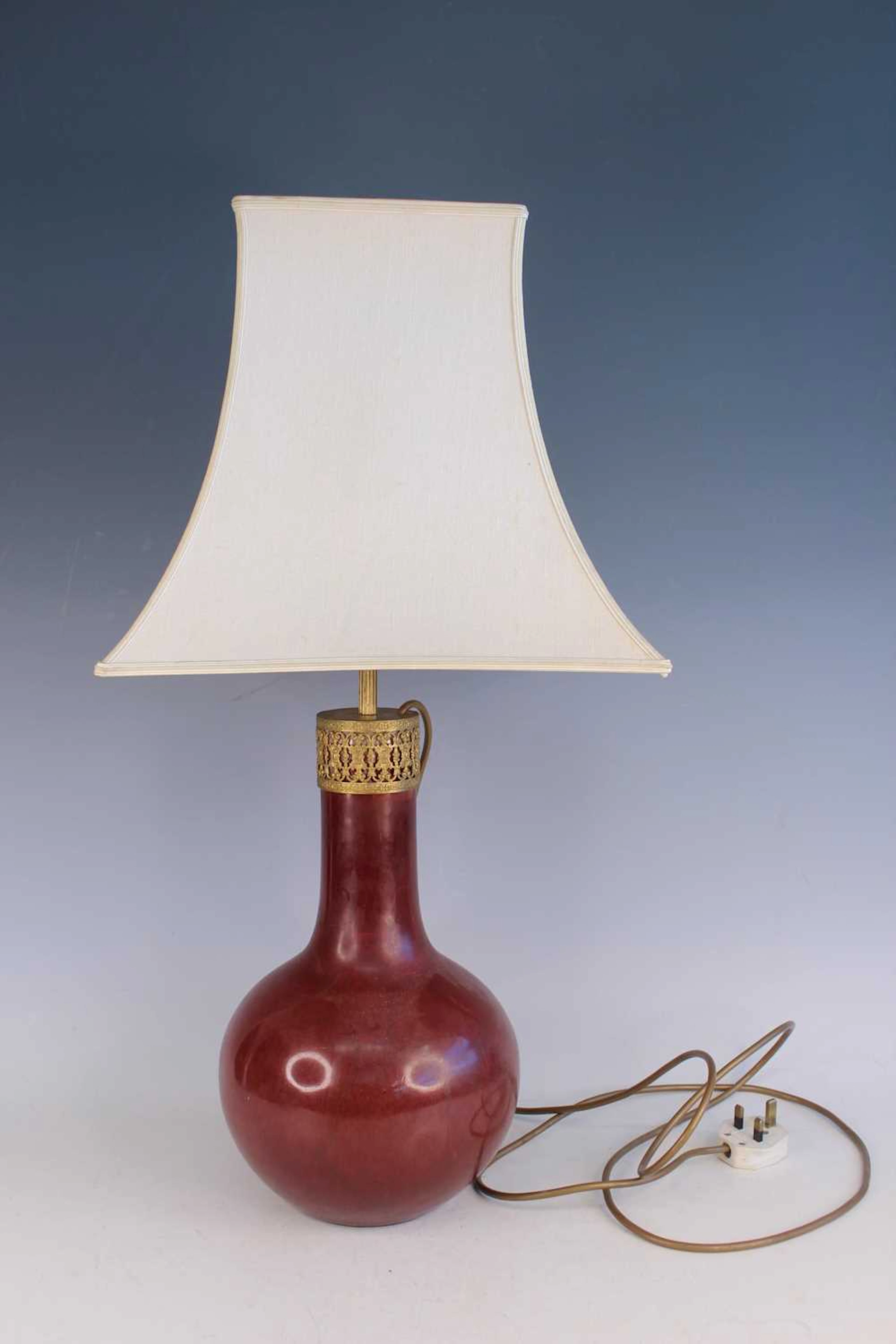 Lot 72 - A Chinese copper-red glazed vase converted