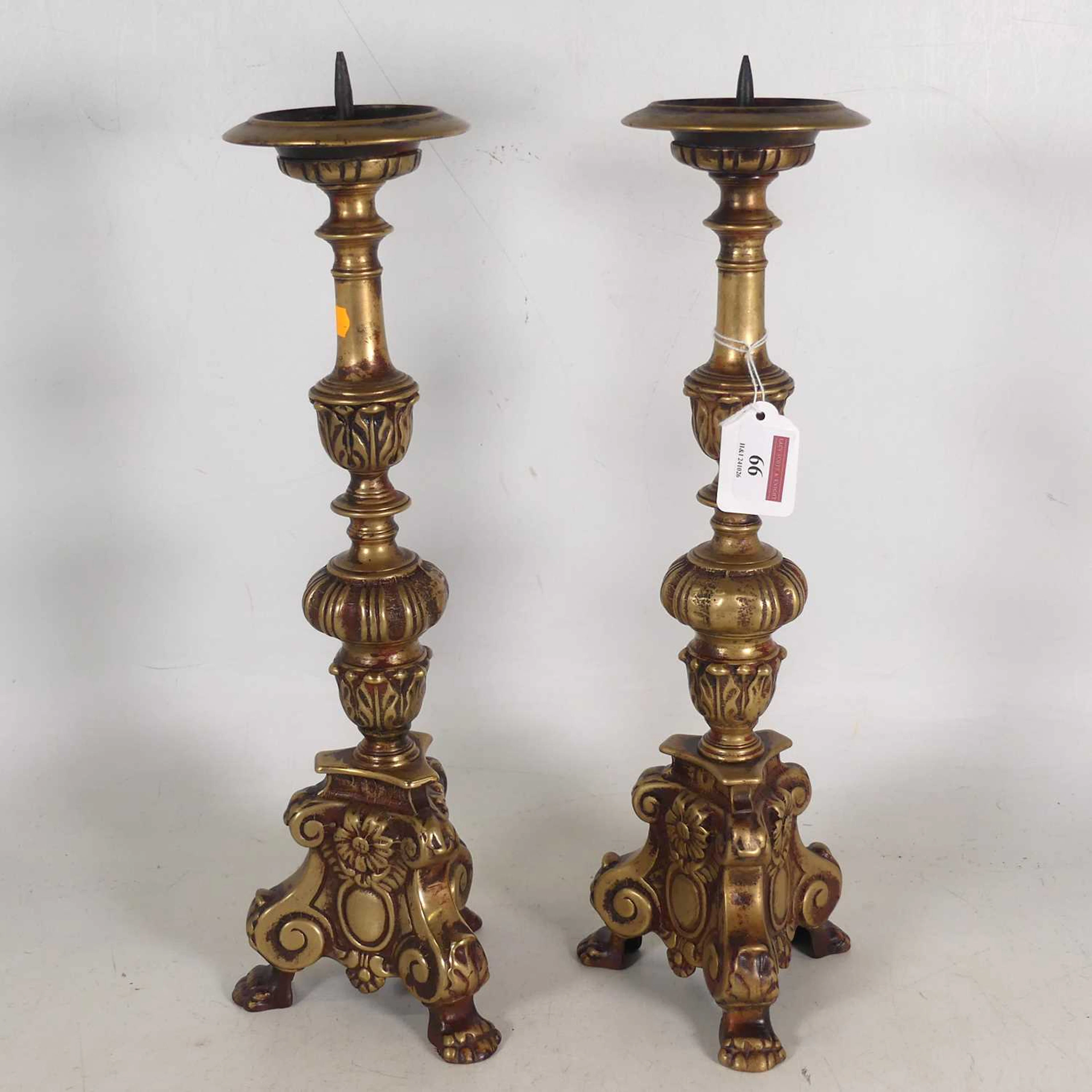 Lot 66 - A pair of cast brass pricket table