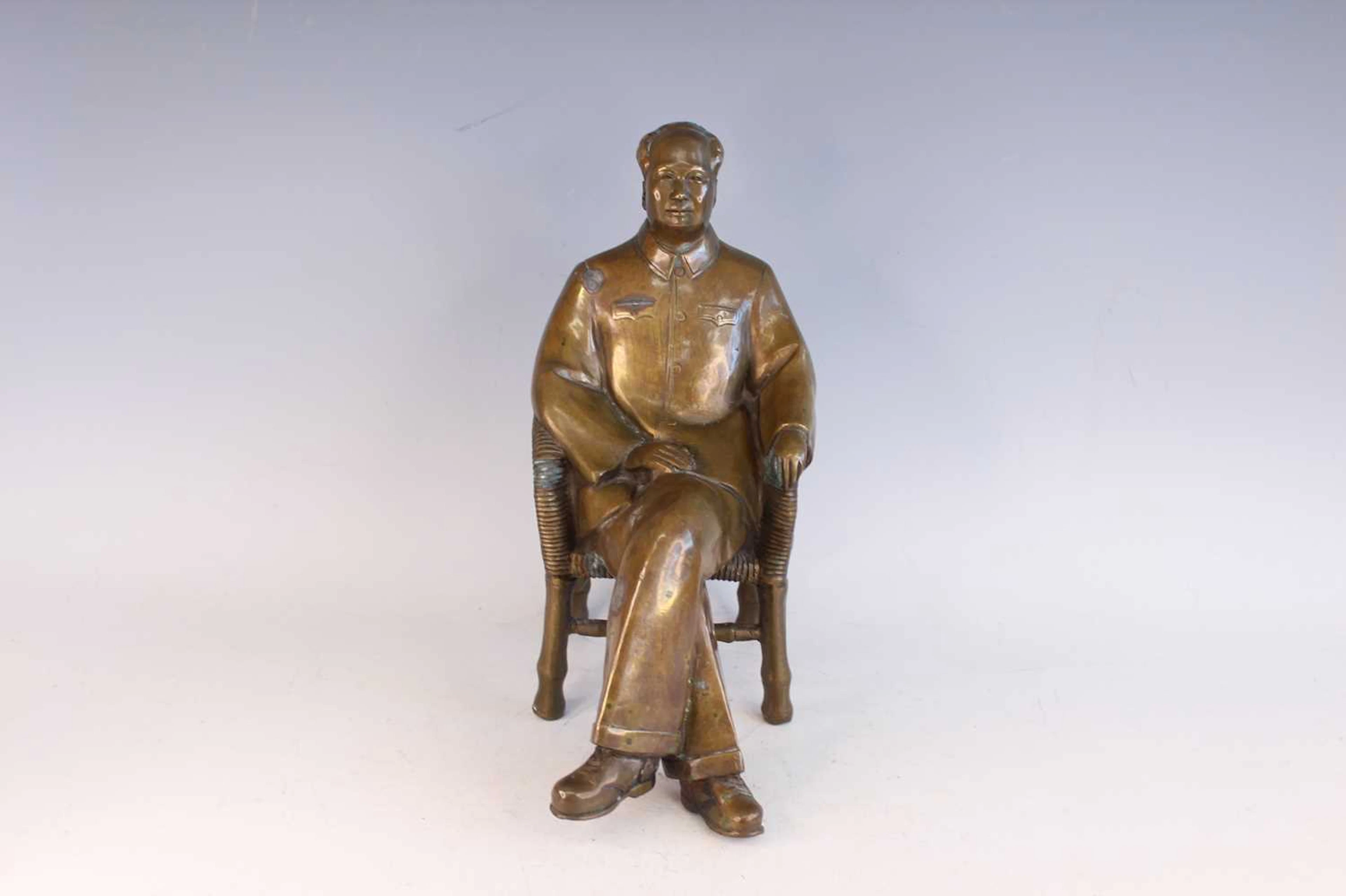 Lot 84 - A Chinese bronze seated figure of Chairman