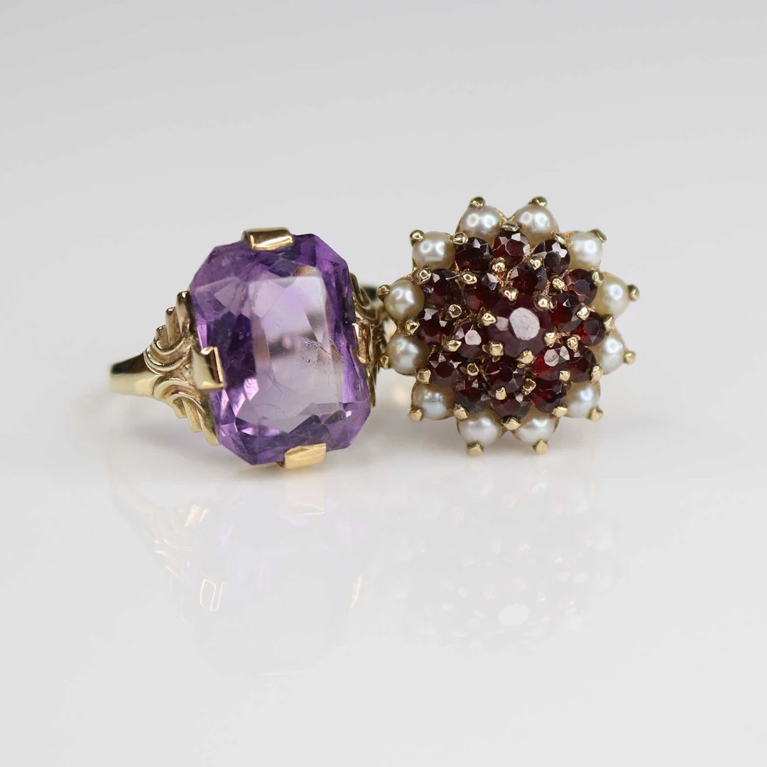 Lot 222 - Two rings, being a 9ct yellow gold, garnet