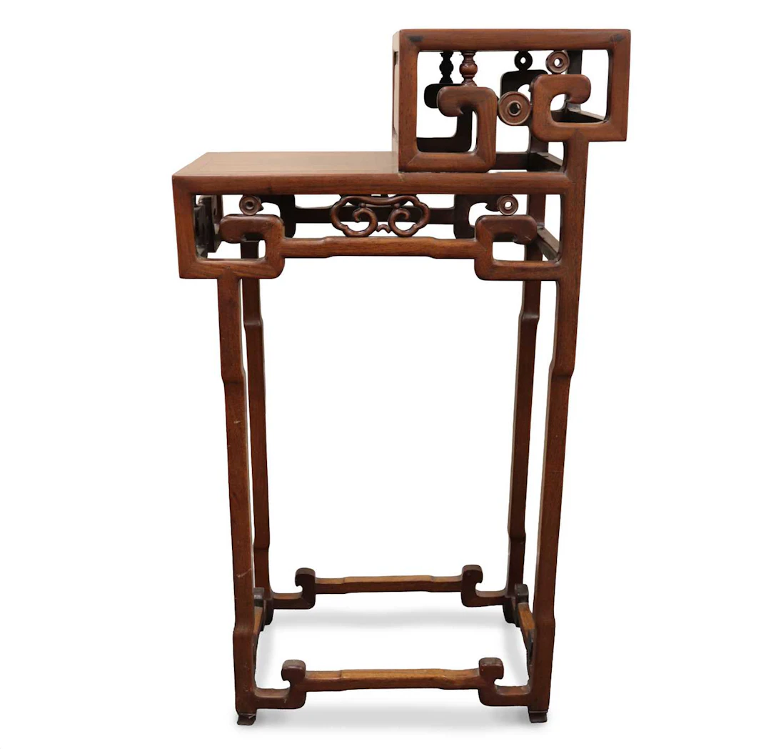 Lot 185 - A Chinese carved hardwood two-tier display