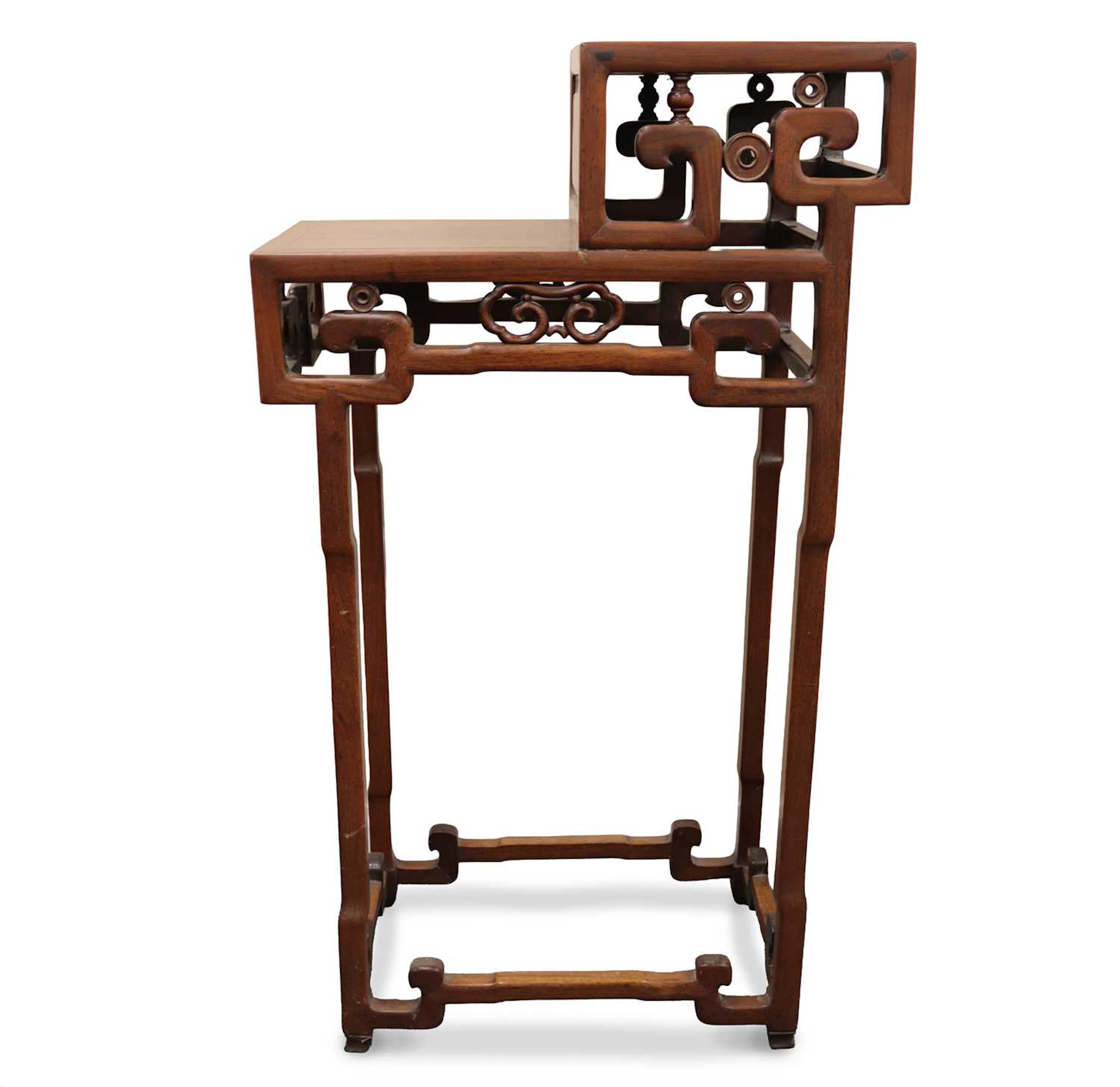 Lot 185 - A Chinese carved hardwood two-tier display
