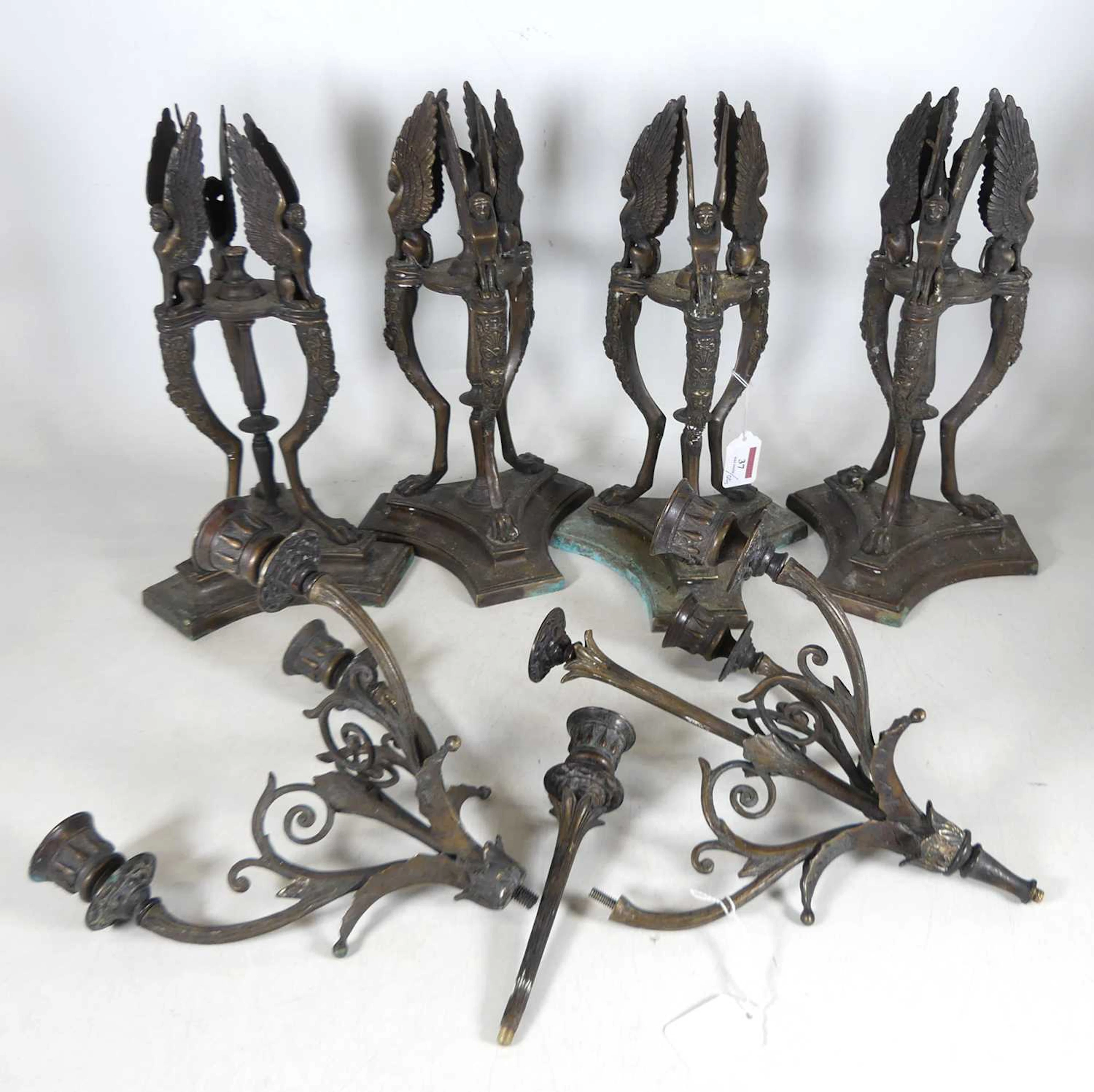 Lot 37 - A set of four bronzed metal Egyptian Revival