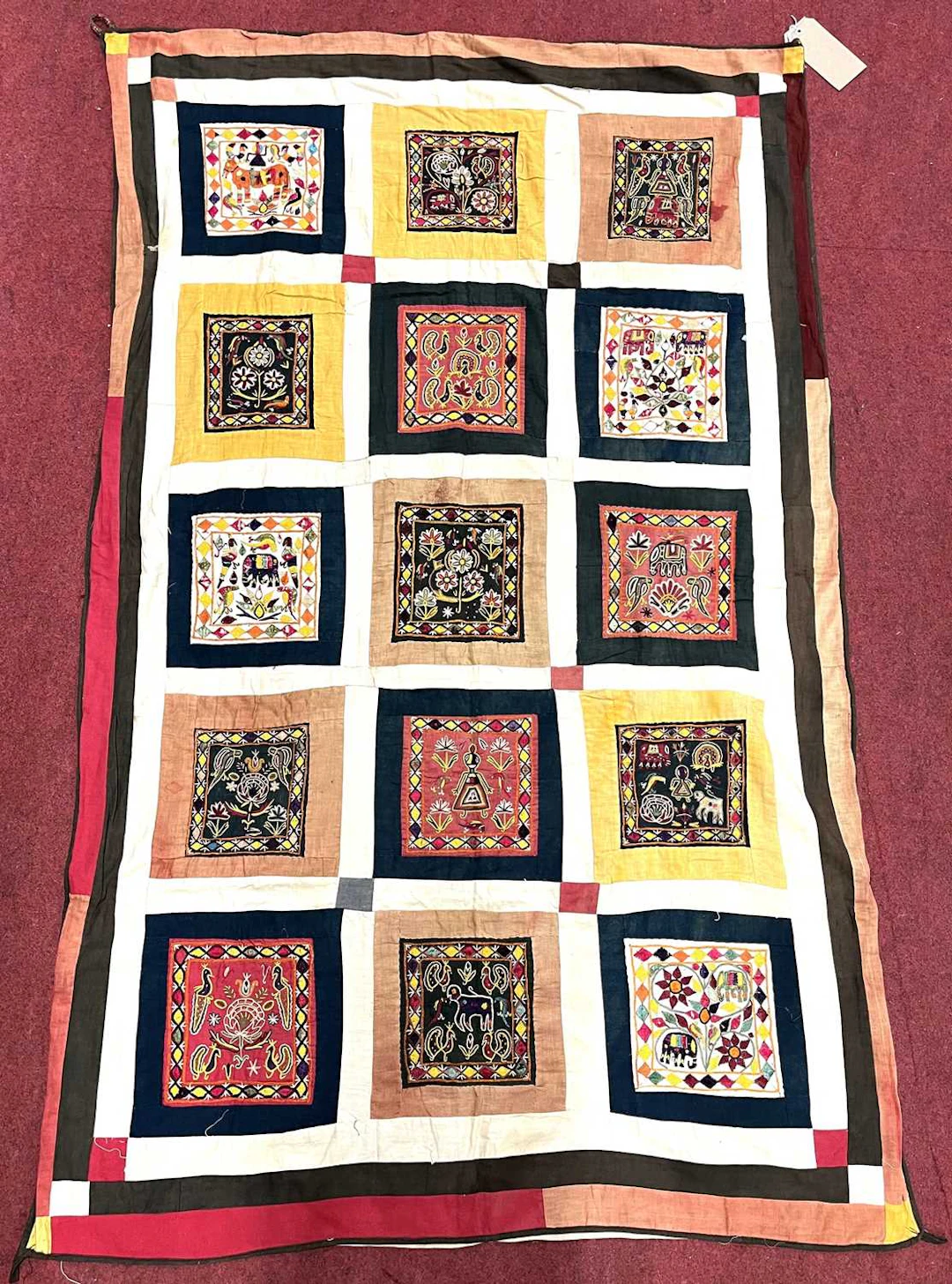 Lot 73 - An Indian patchwork wall hanging, stitched