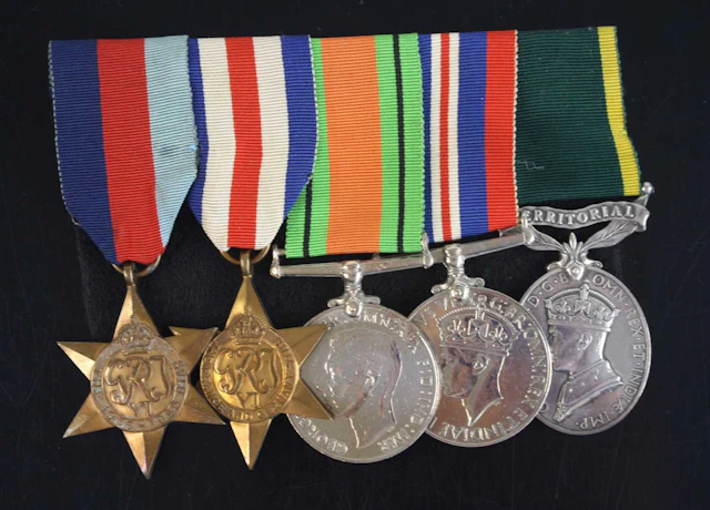 Lot 1270 - A group of five medals to include WW II