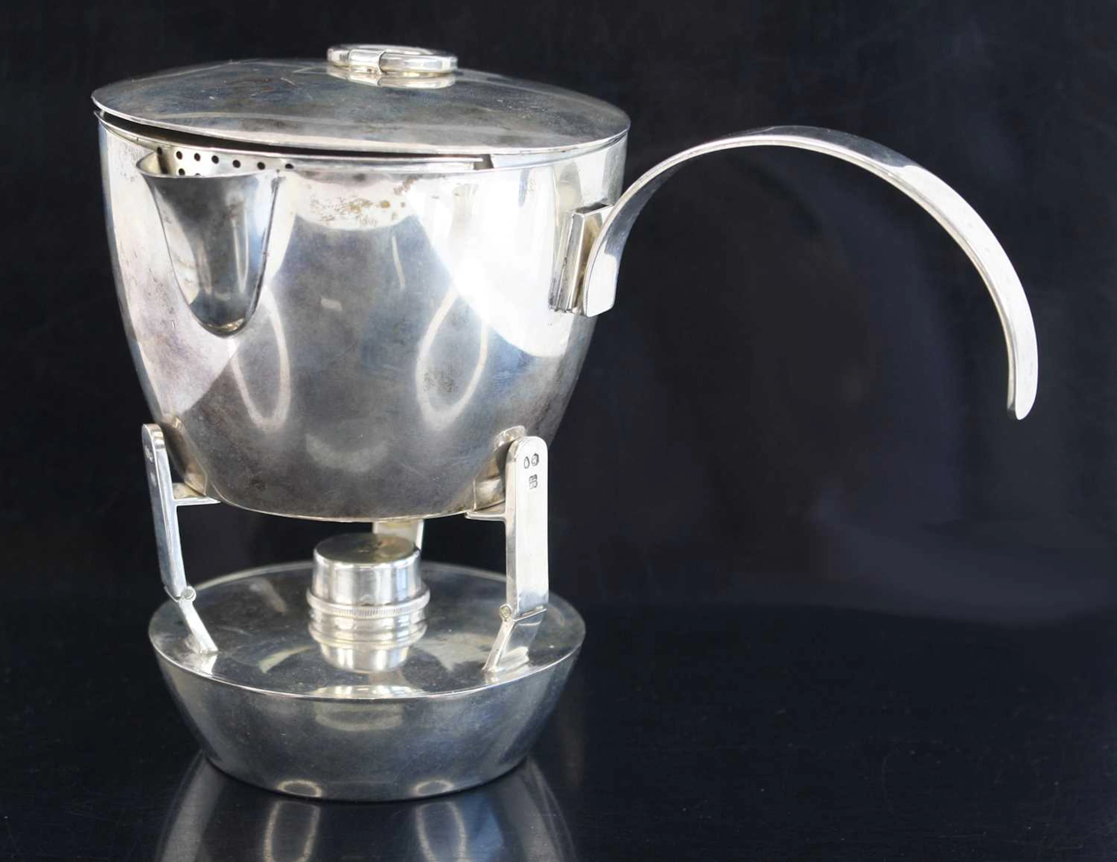 Lot 1004 - A late Victorian silver campaign stove, the