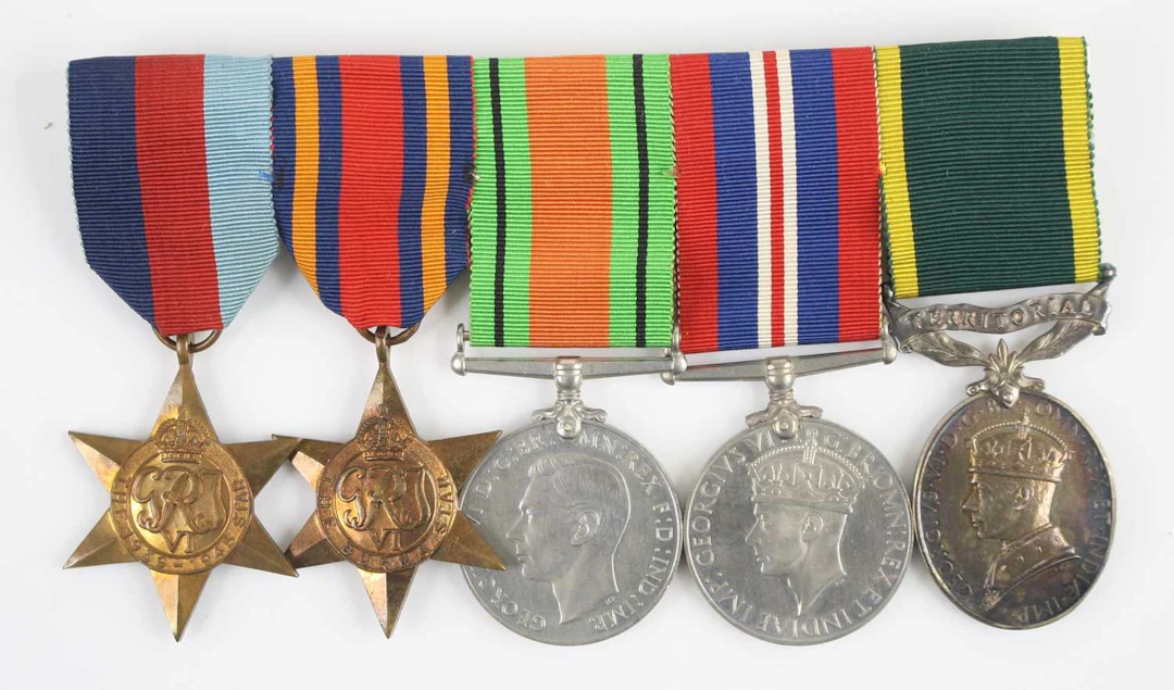 Lot 1216 - A group of five medals to include WW II