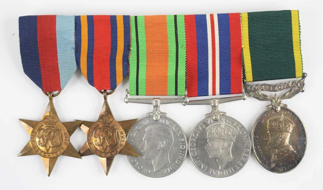 Lot 1216 - A group of five medals to include WW II