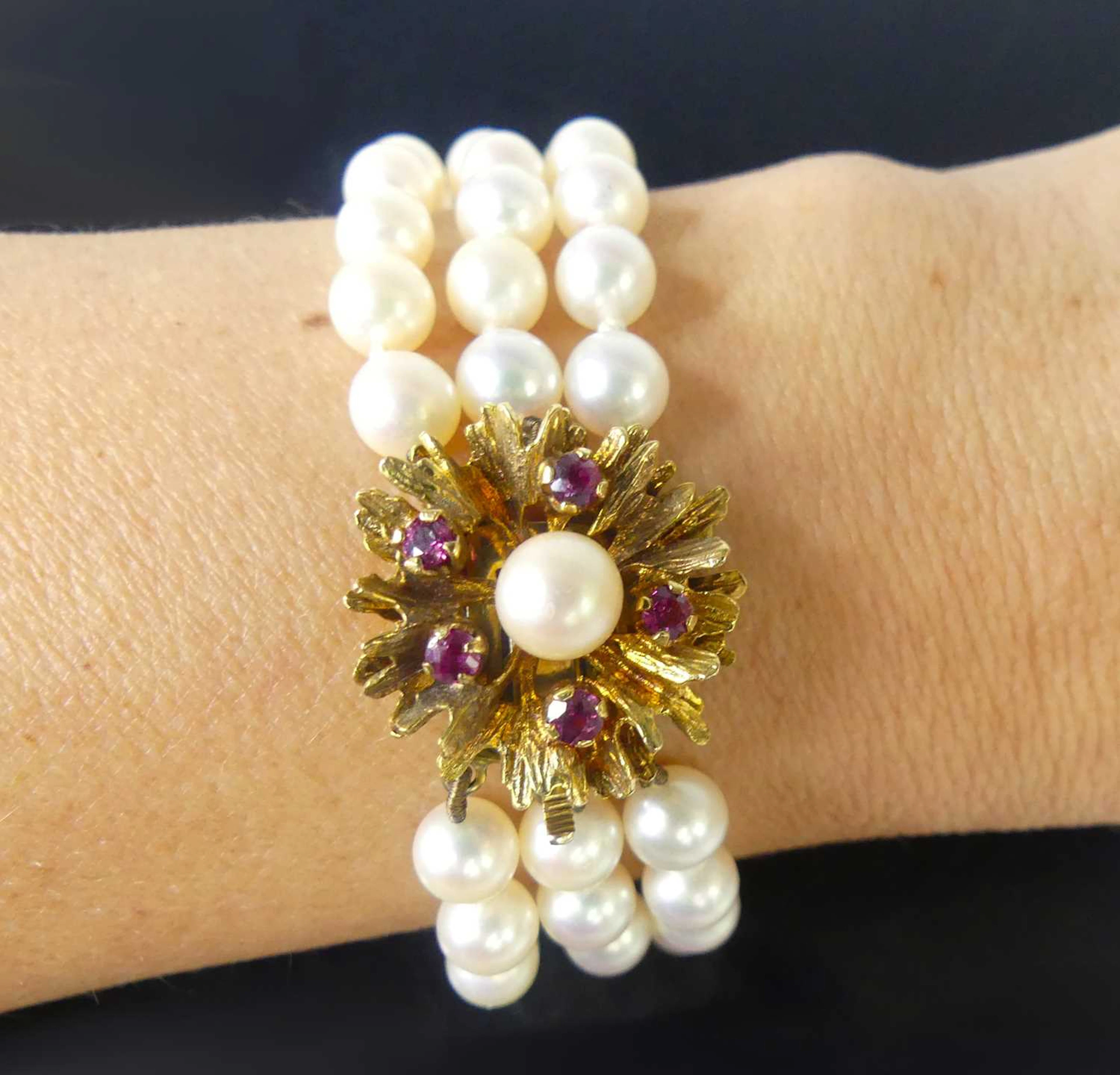 Lot 2513 - A three-row cultured Akoya pearl bracelet