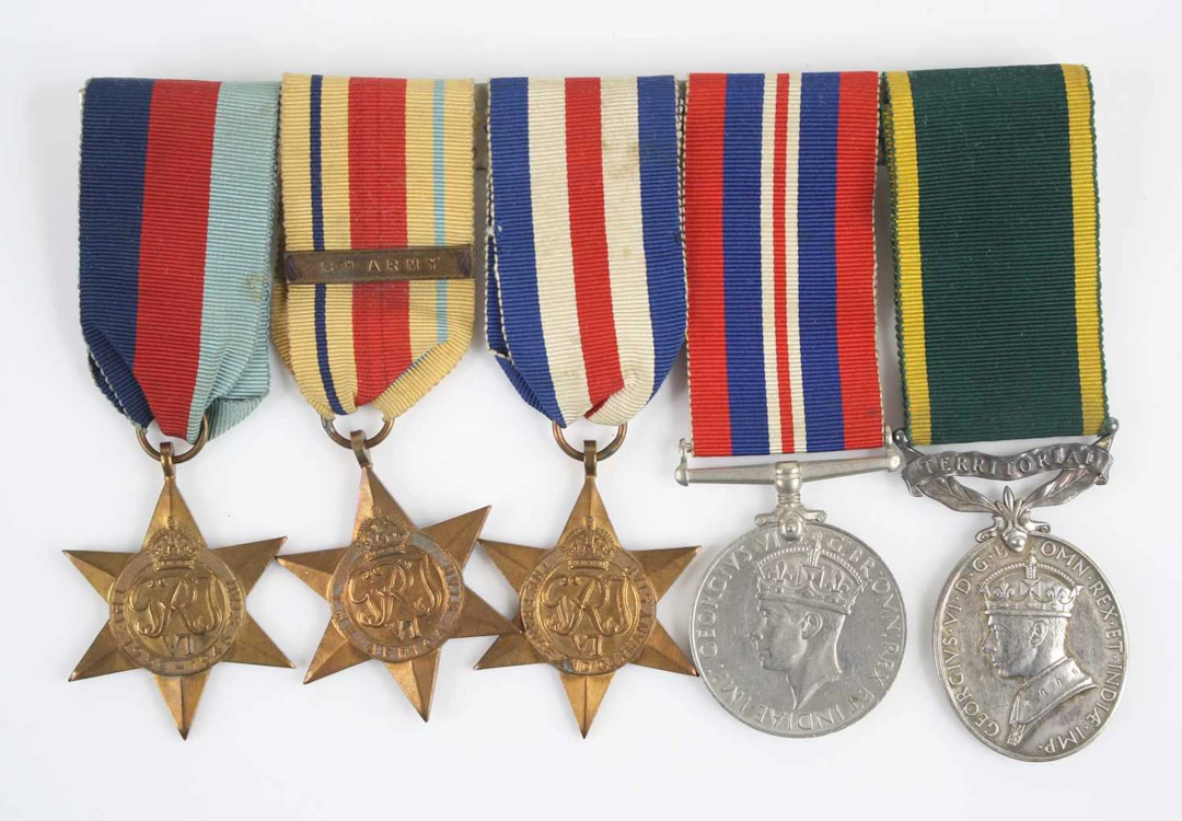 Lot 1221 - A group of five medals to include WW II