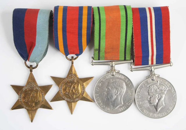 Lot 1161 - A group of four WW II medals to include
