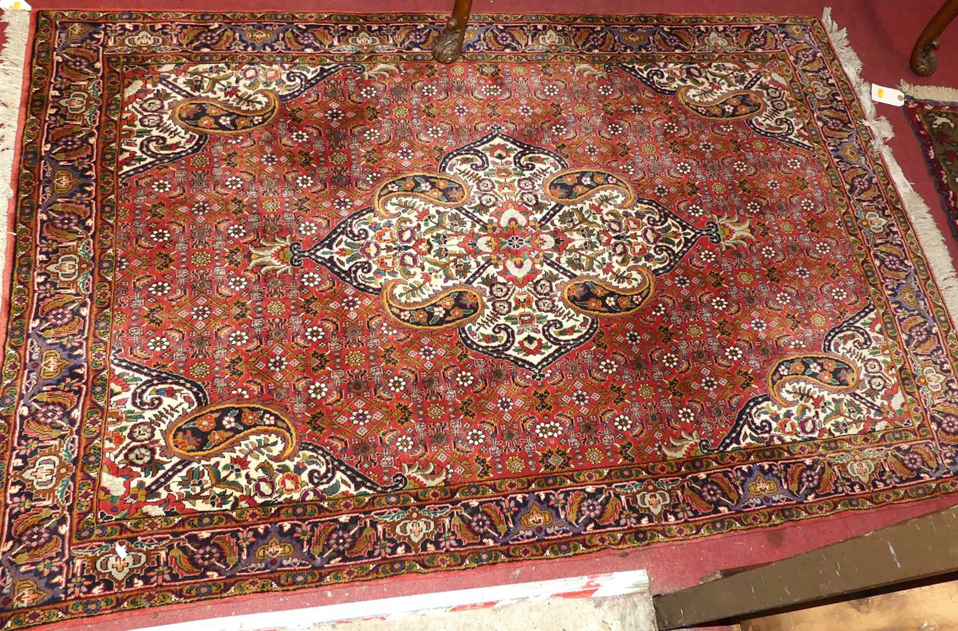 Lot 770 - A Persian woollen red, blue and cream ground