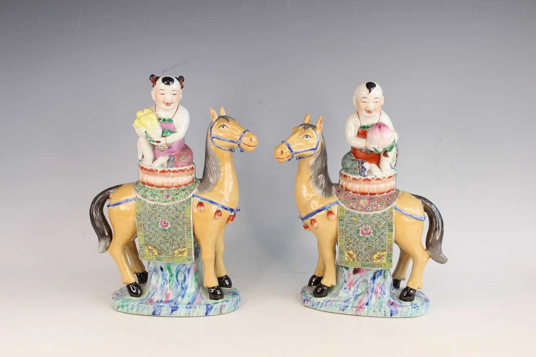 Lot 21 - A Pair of Chinese Famille Rose Figures of