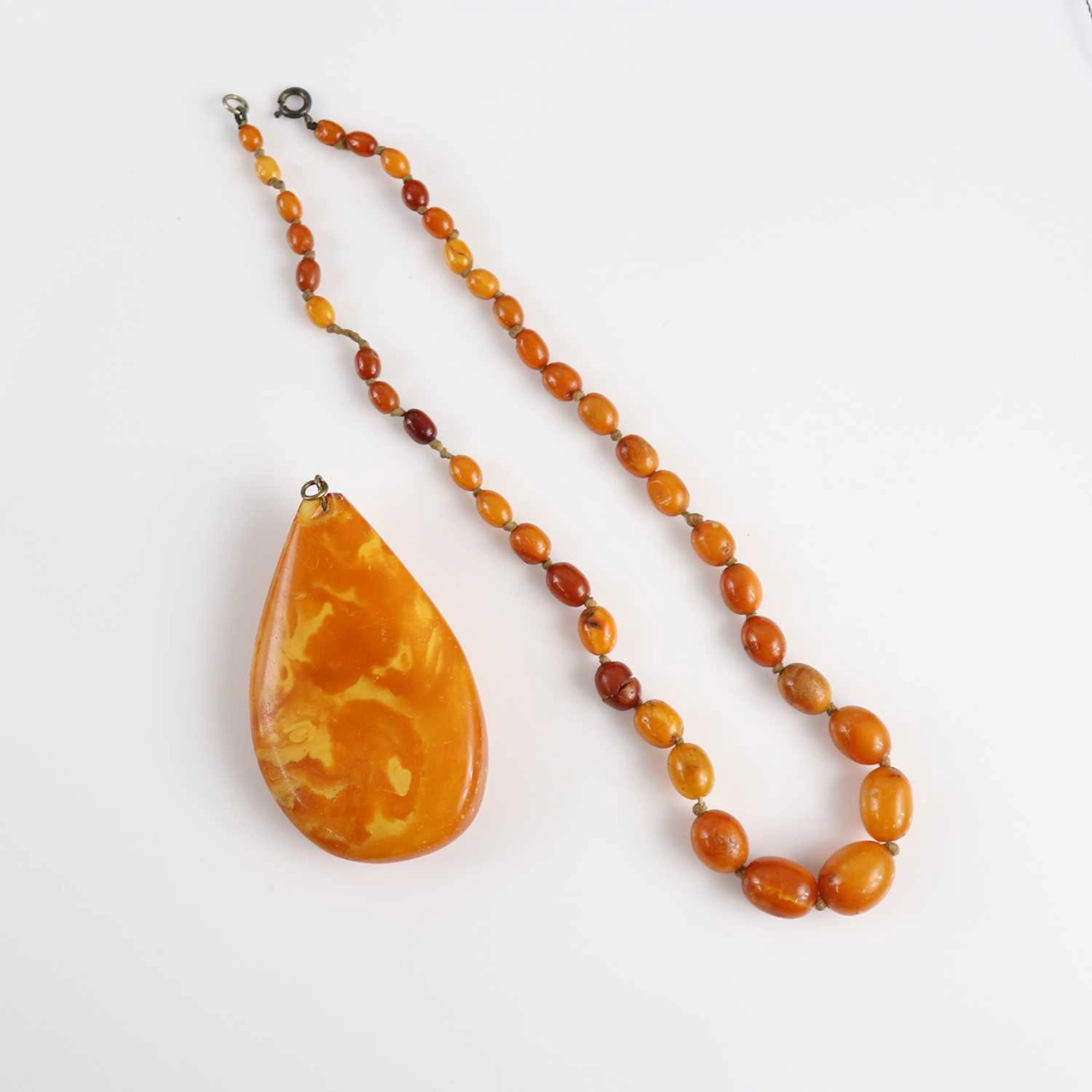 Lot 211 - A Baltic butterscotch amber pear shaped