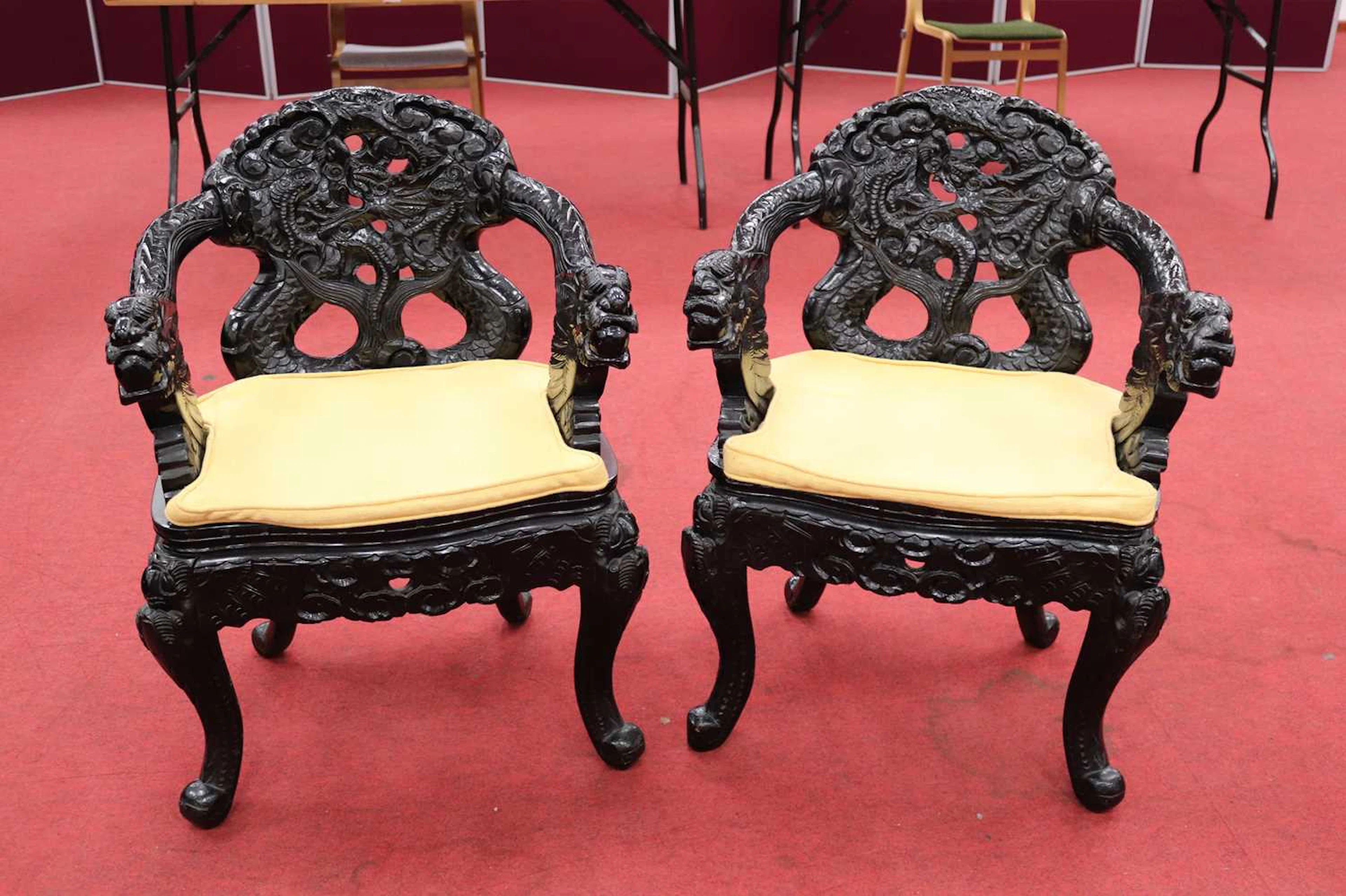 Lot 180 - A pair of Chinese black lacquered carved