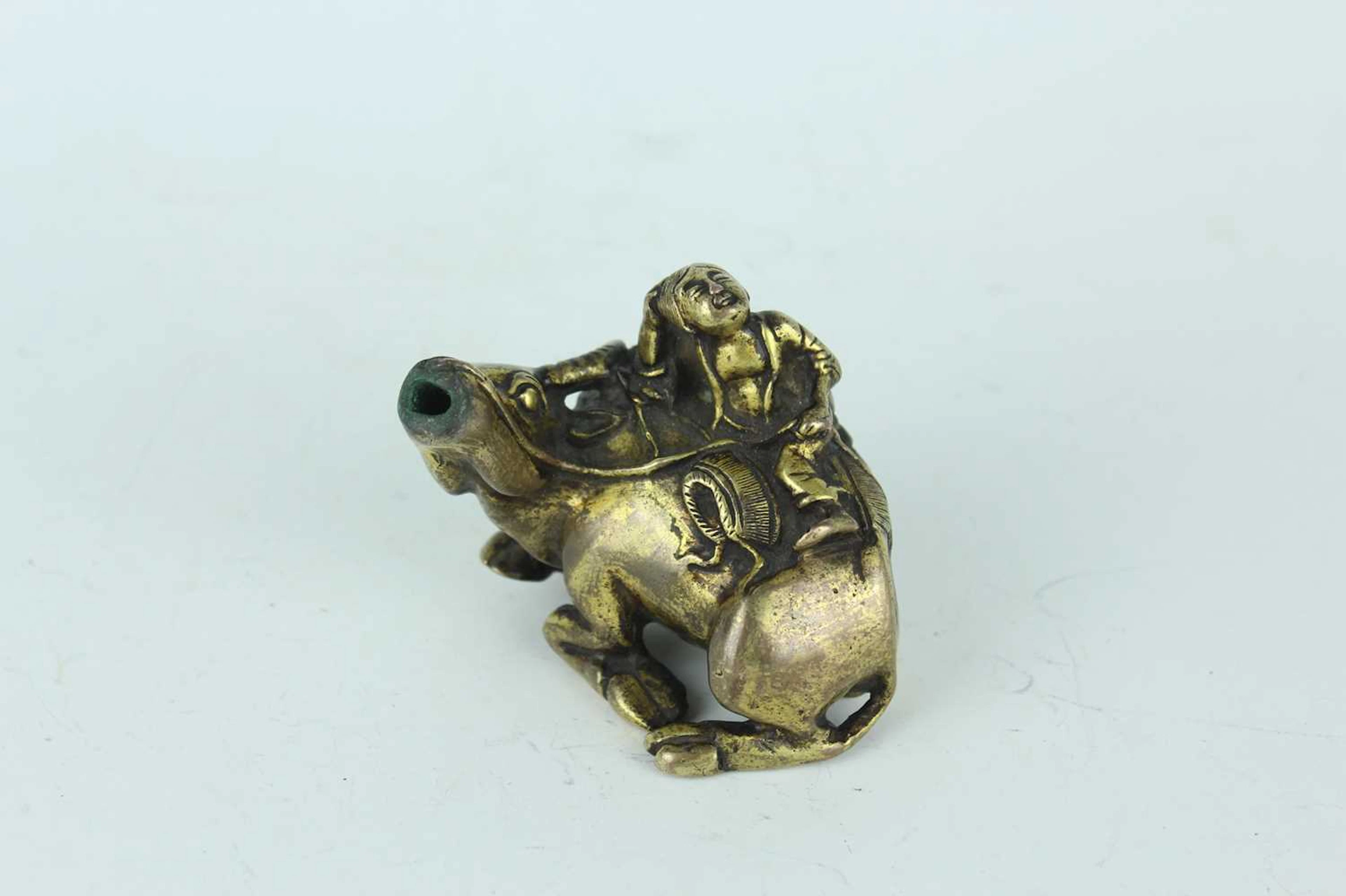 Lot 30 - A Chinese gilded bronze ‘boy on a buffalo’