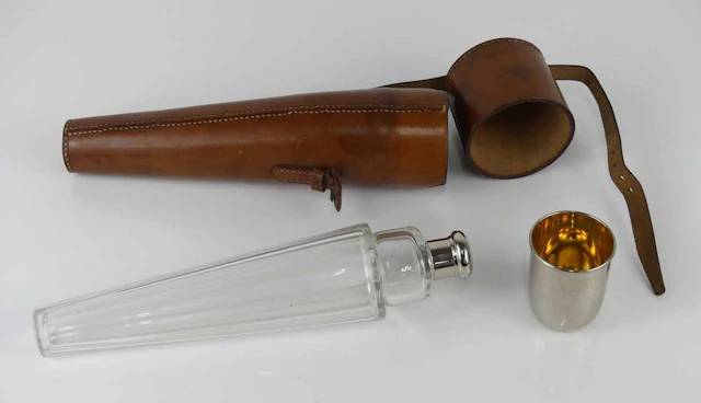 Lot 1301 - A leather cased hunting flask, having a