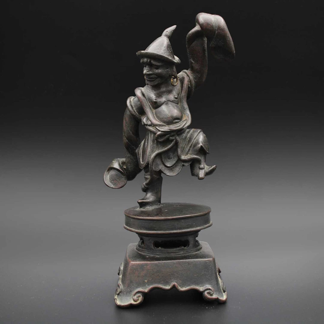 Lot 32 - A Chinese bronze figure of a dancing