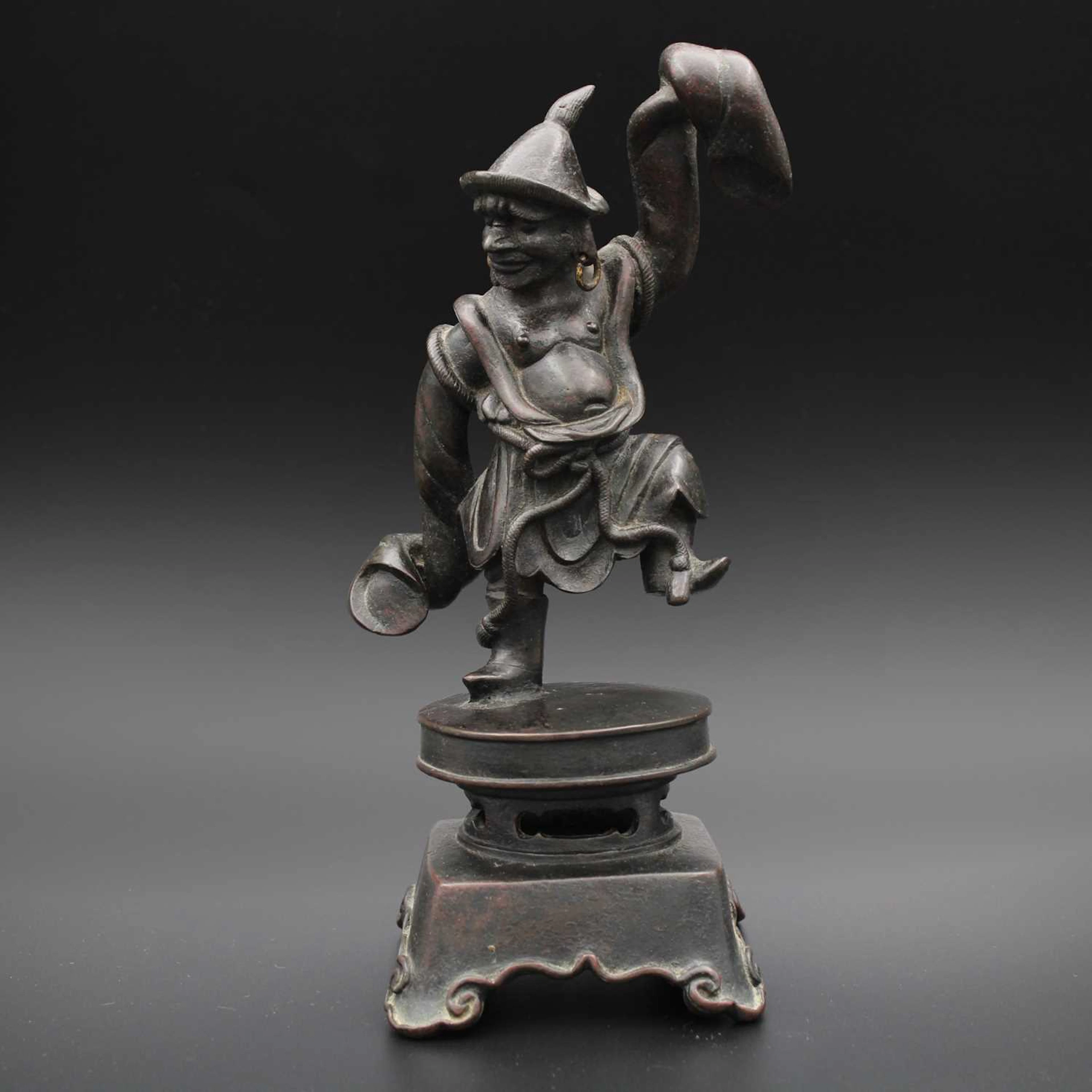 Lot 32 - A Chinese bronze figure of a dancing