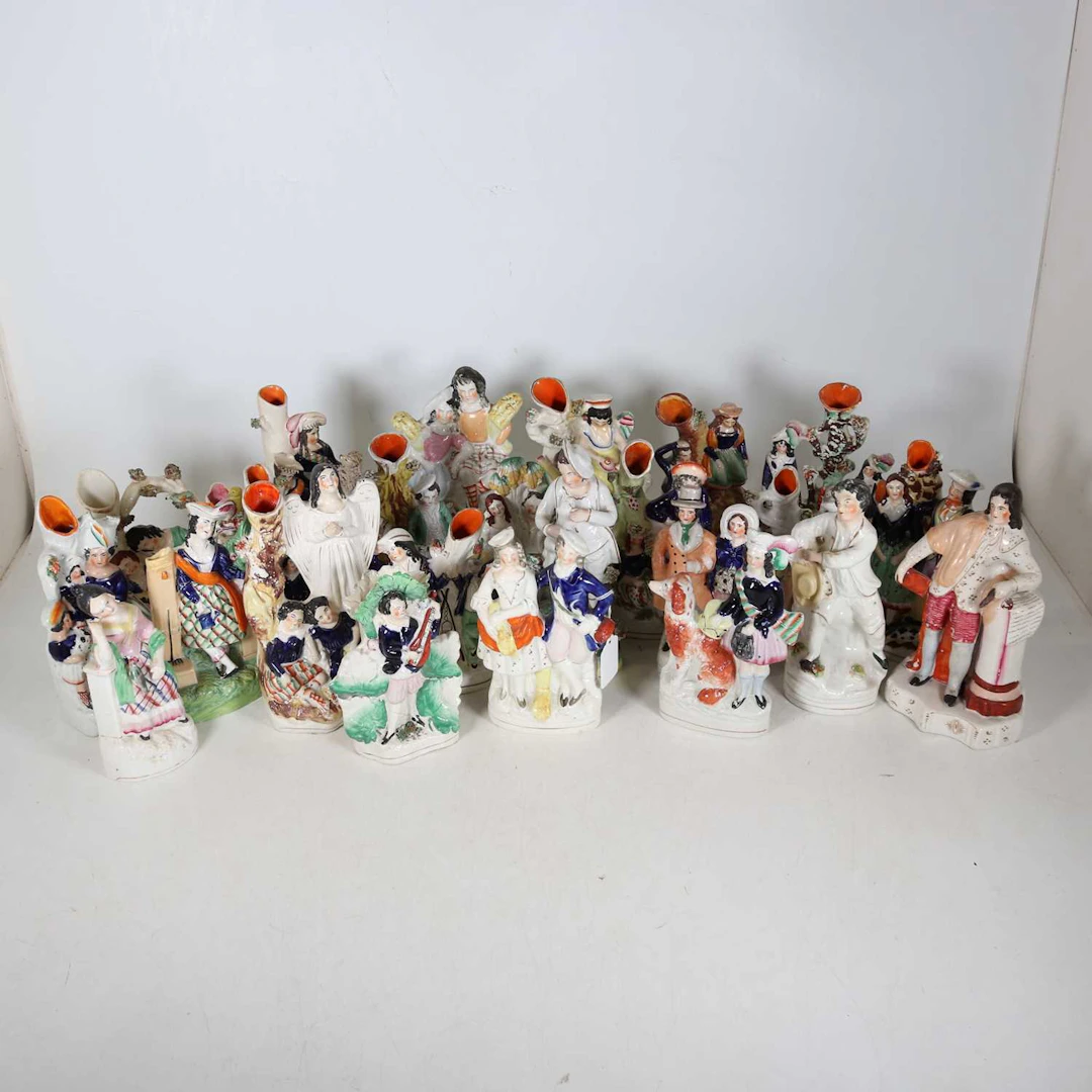 Lot 129 - A collection of Staffordshire figures, to