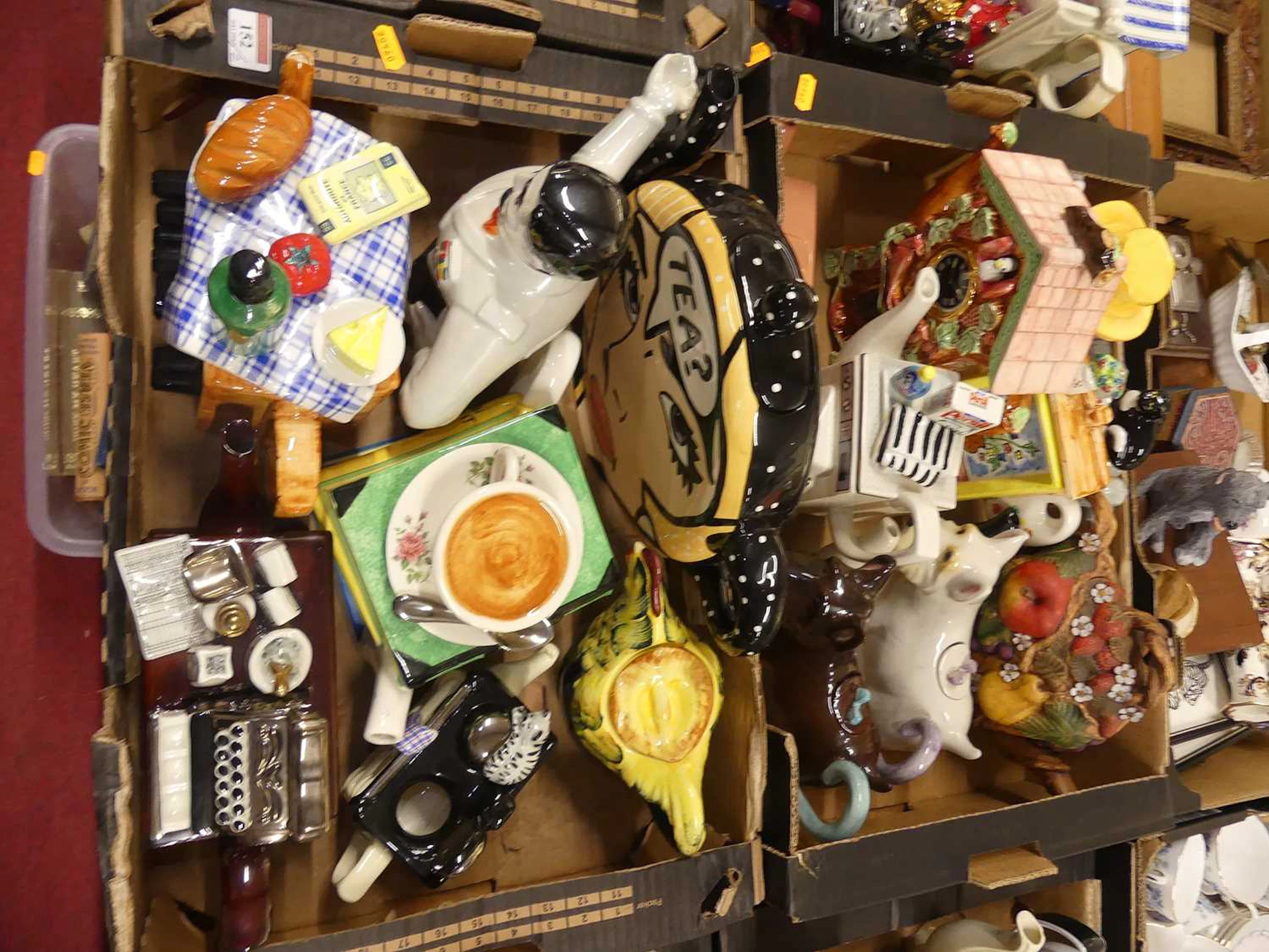 Lot 152 - A collection of novelty teapots, to include