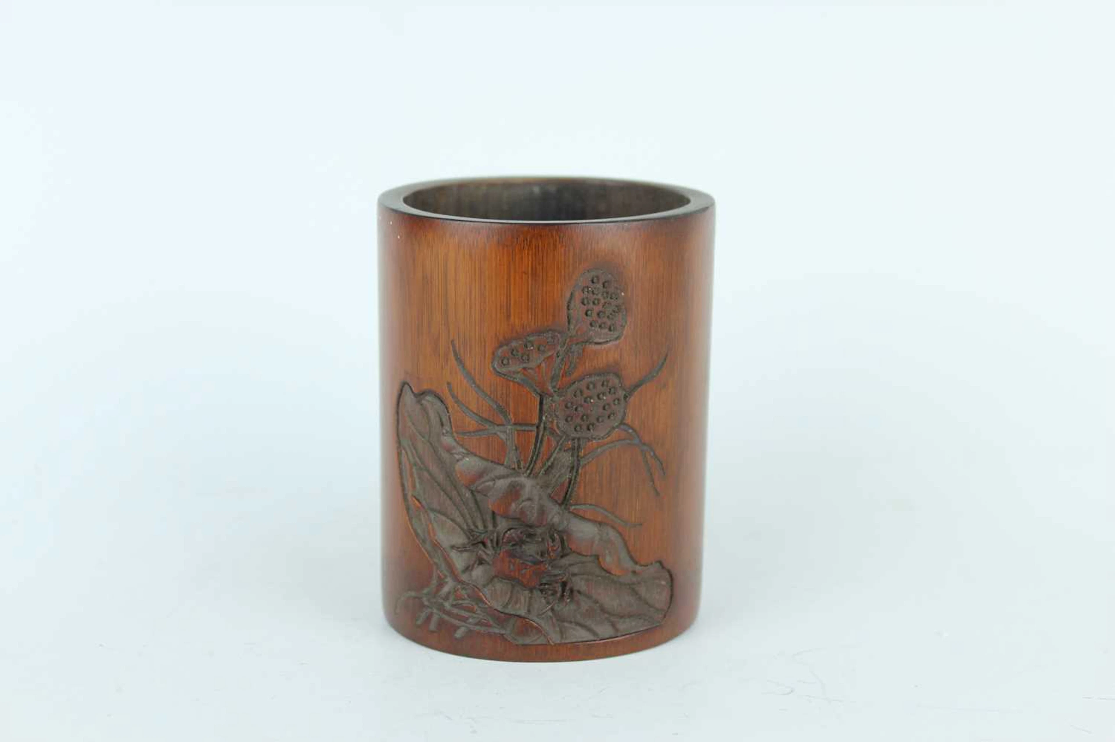 Lot 166 - A small Chinese bamboo brush pot carved with