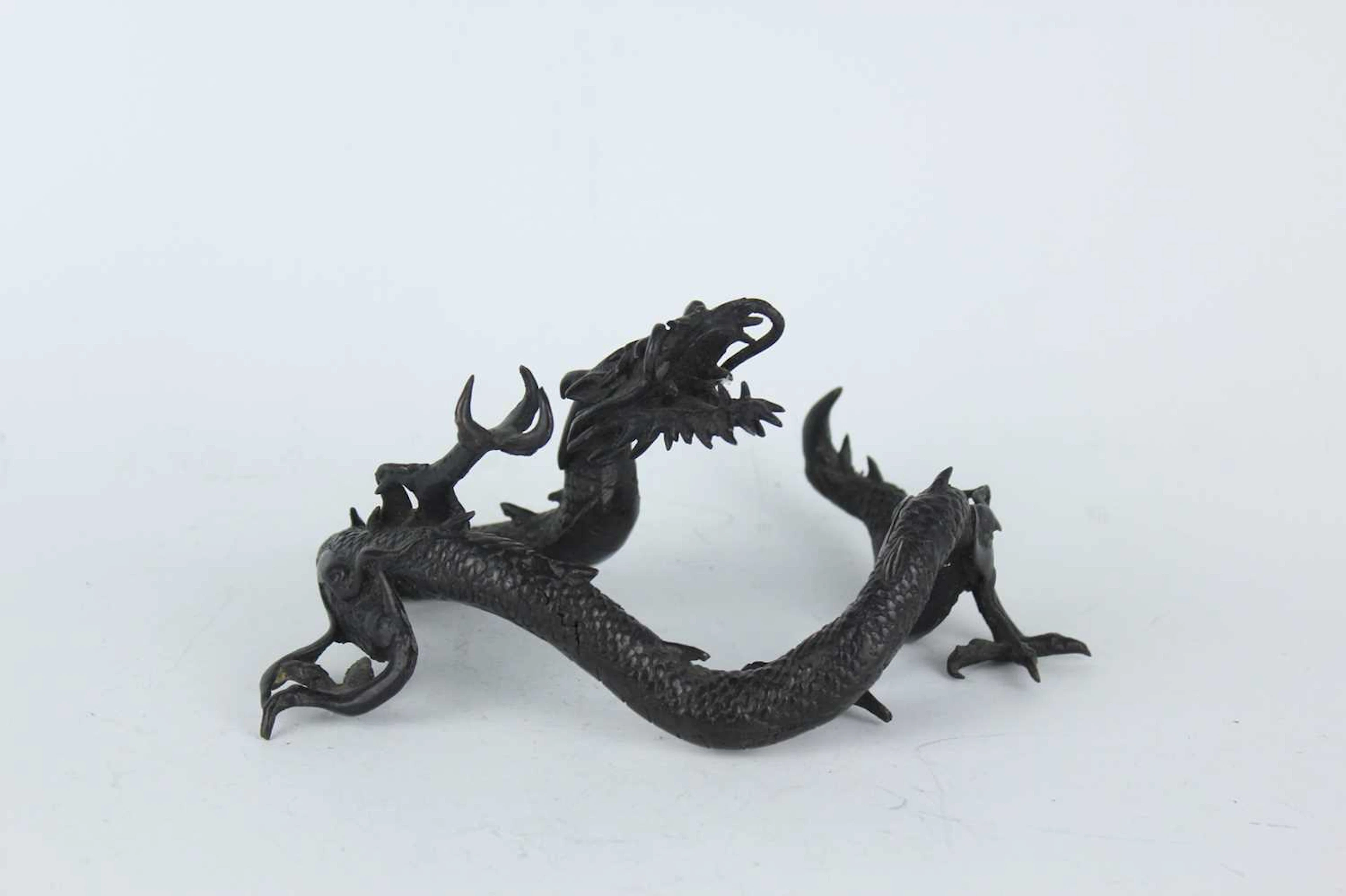 Lot 209 - A Japanese bronze okimono of a dragon, Meiji