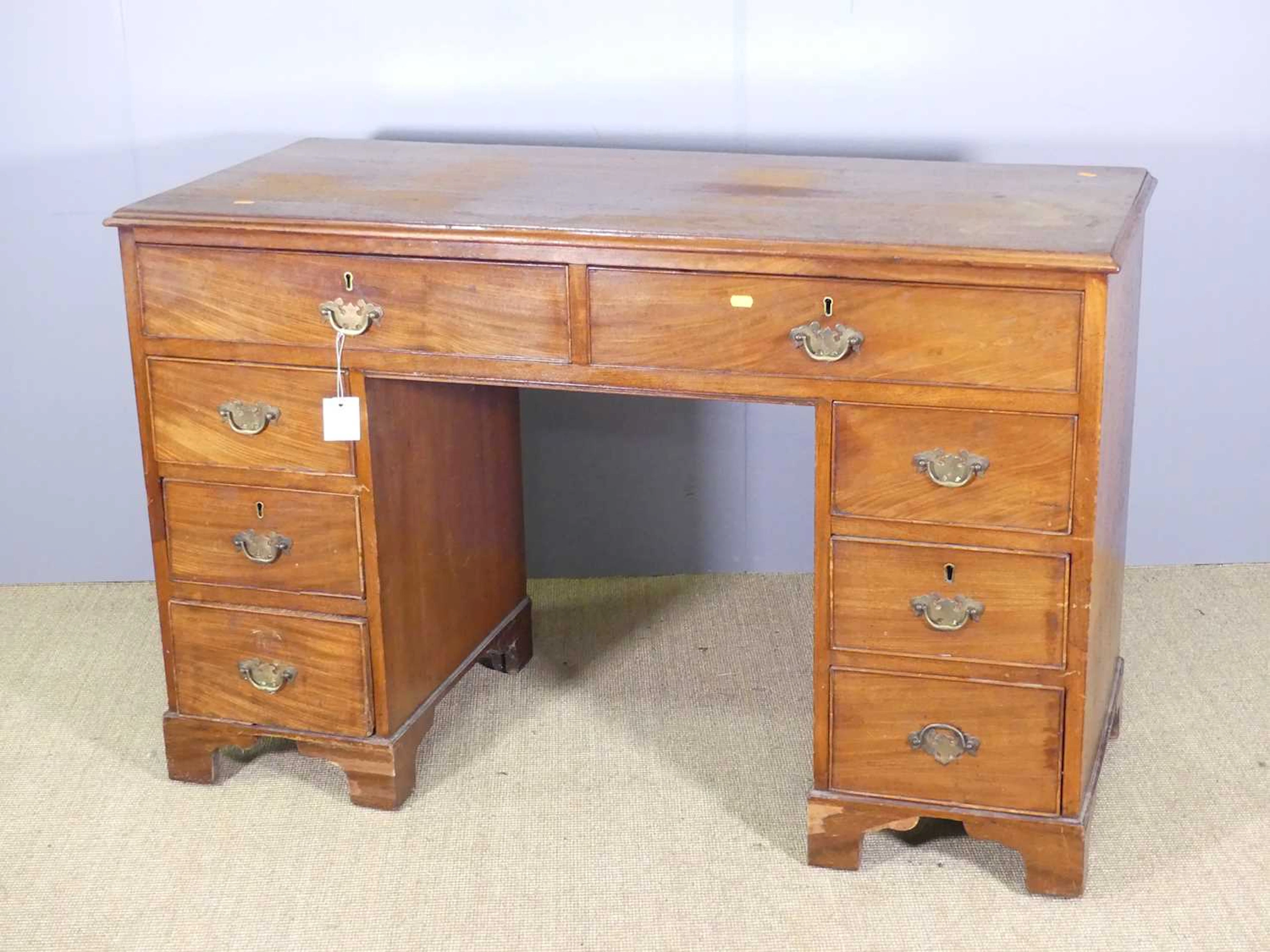 Lot 708 - A 19th century mahogany kneehole desk