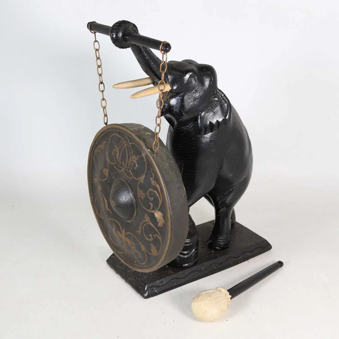 Lot 5 - A table-top gong, 20th century, the support in