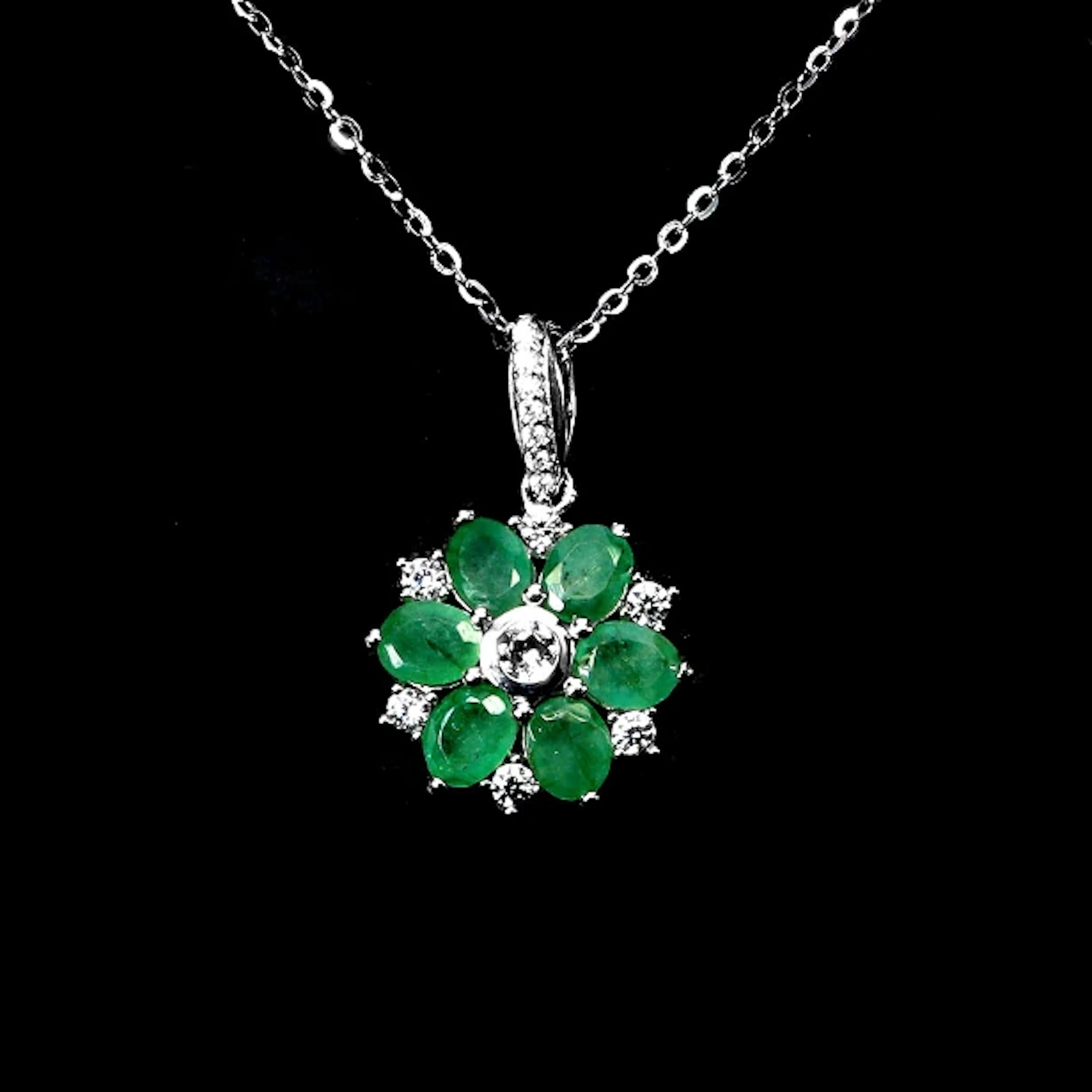 Pendant in rhodium-plated Sterling Silver, adorned with numerous emeralds