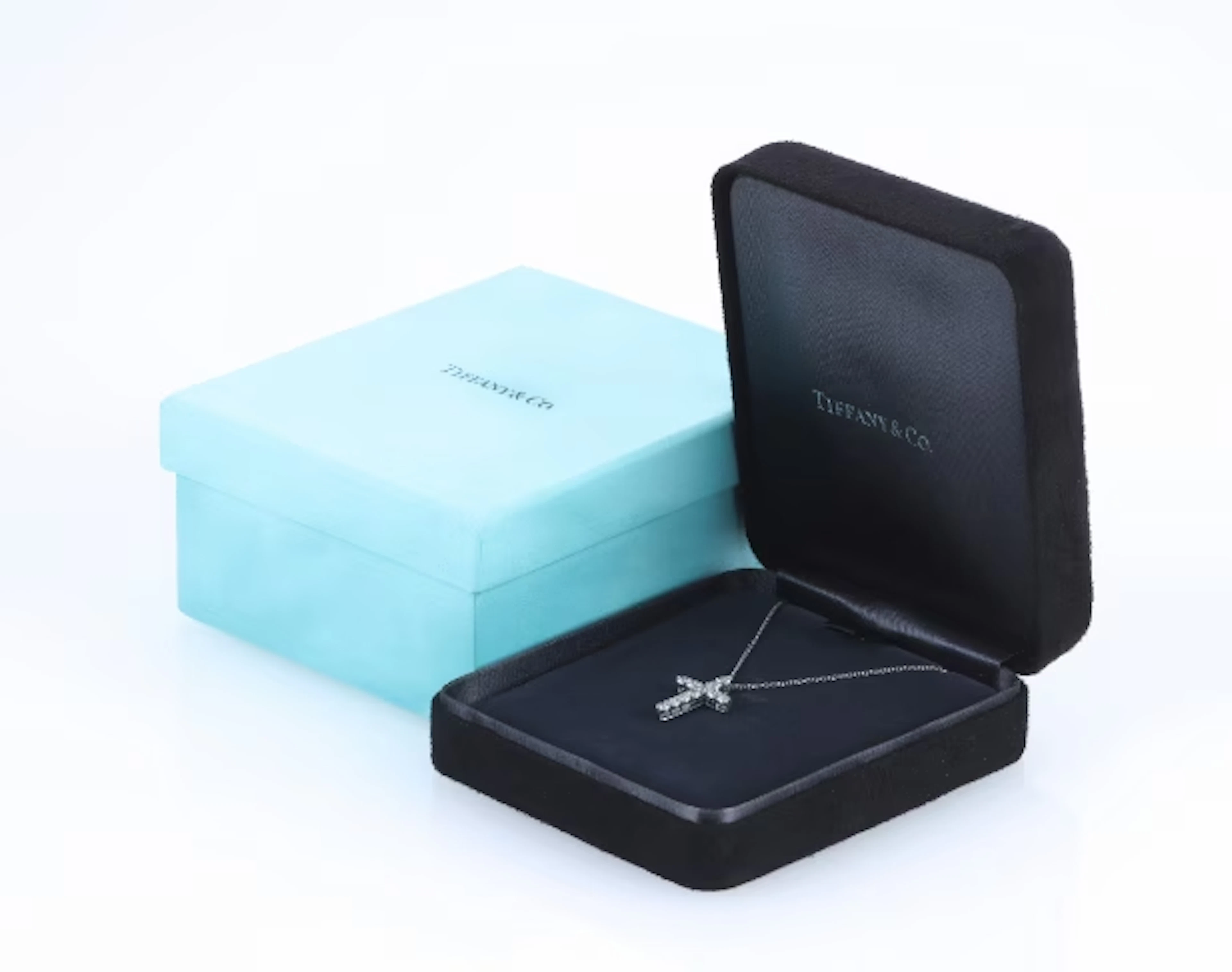 Tiffany & Co. Brilliant cross pendant in platinum with necklace, approx.