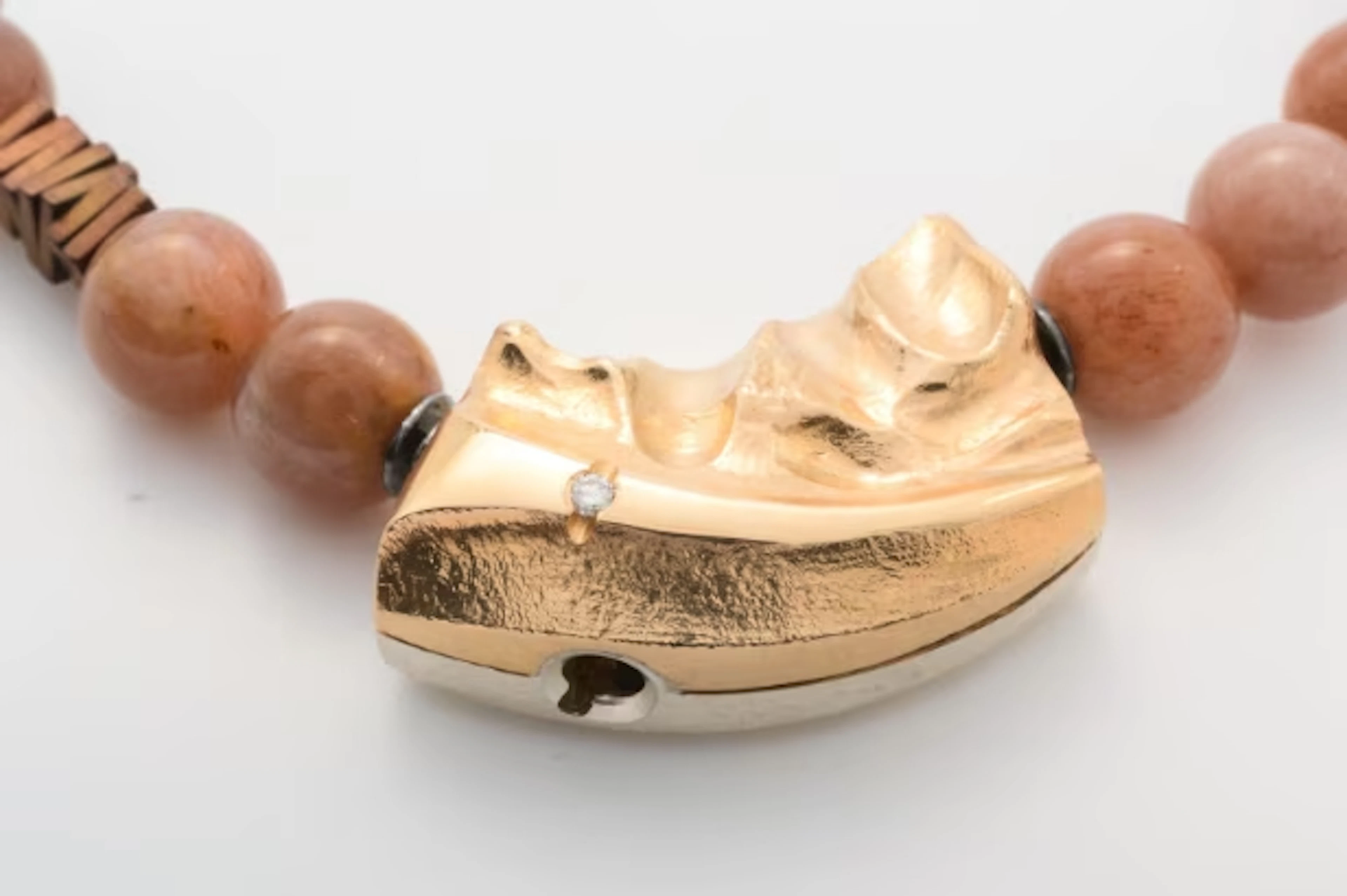 Connection clasp made of 14 kt. gold and sterling silver with brilliant