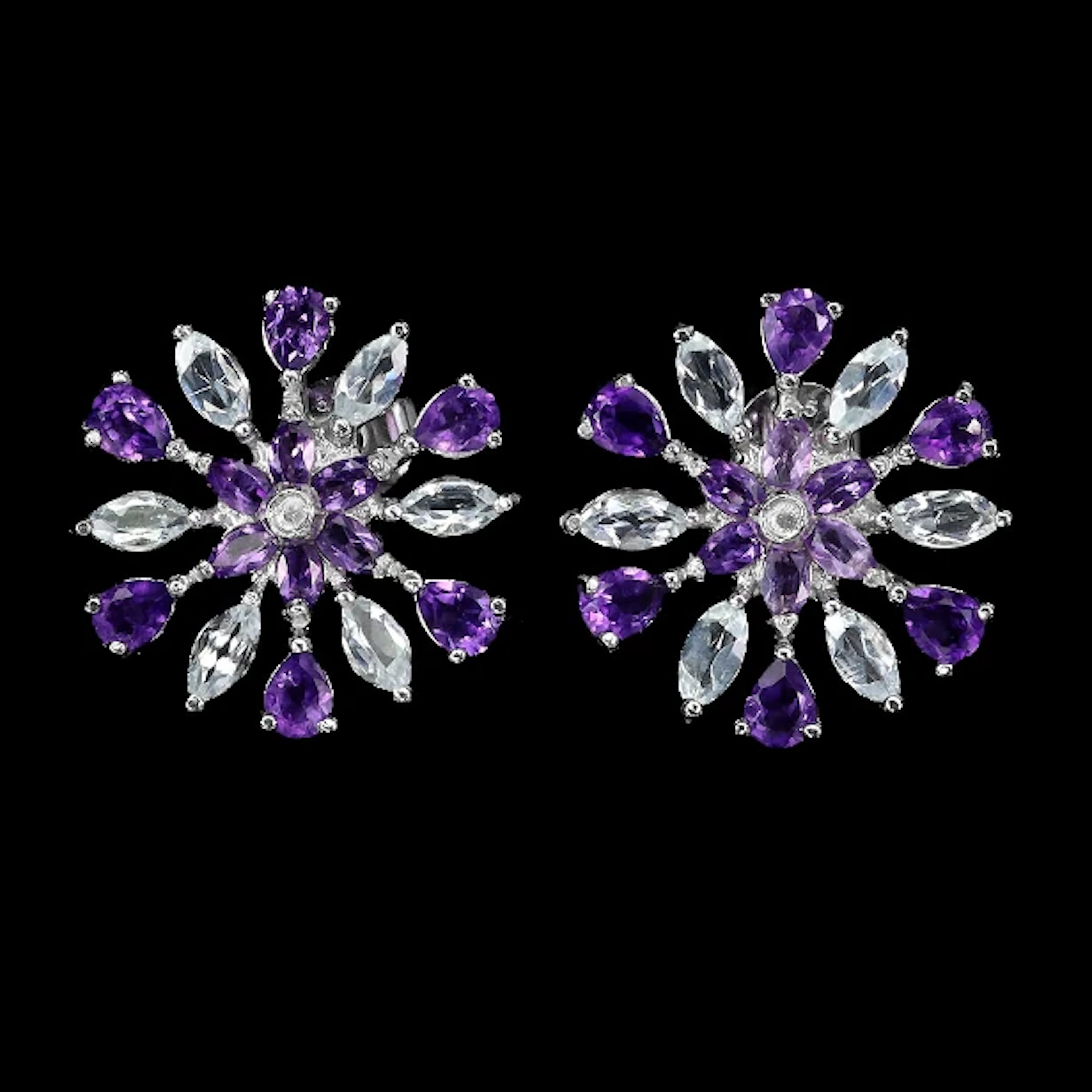 Earrings in rhodium-plated Sterling silver with aquamarines and amethysts.