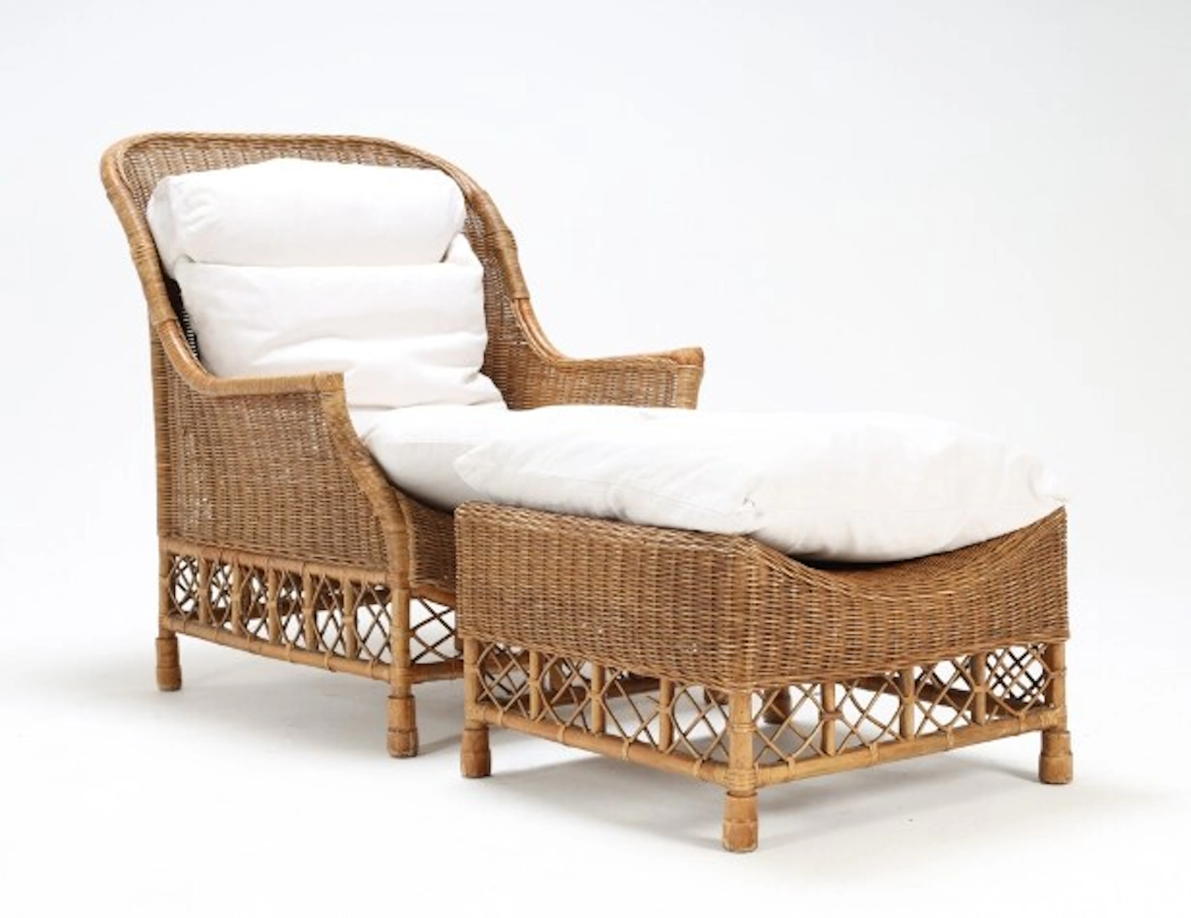 'Karen Blixen' armchair and stool made of woven natural rattan. (2)