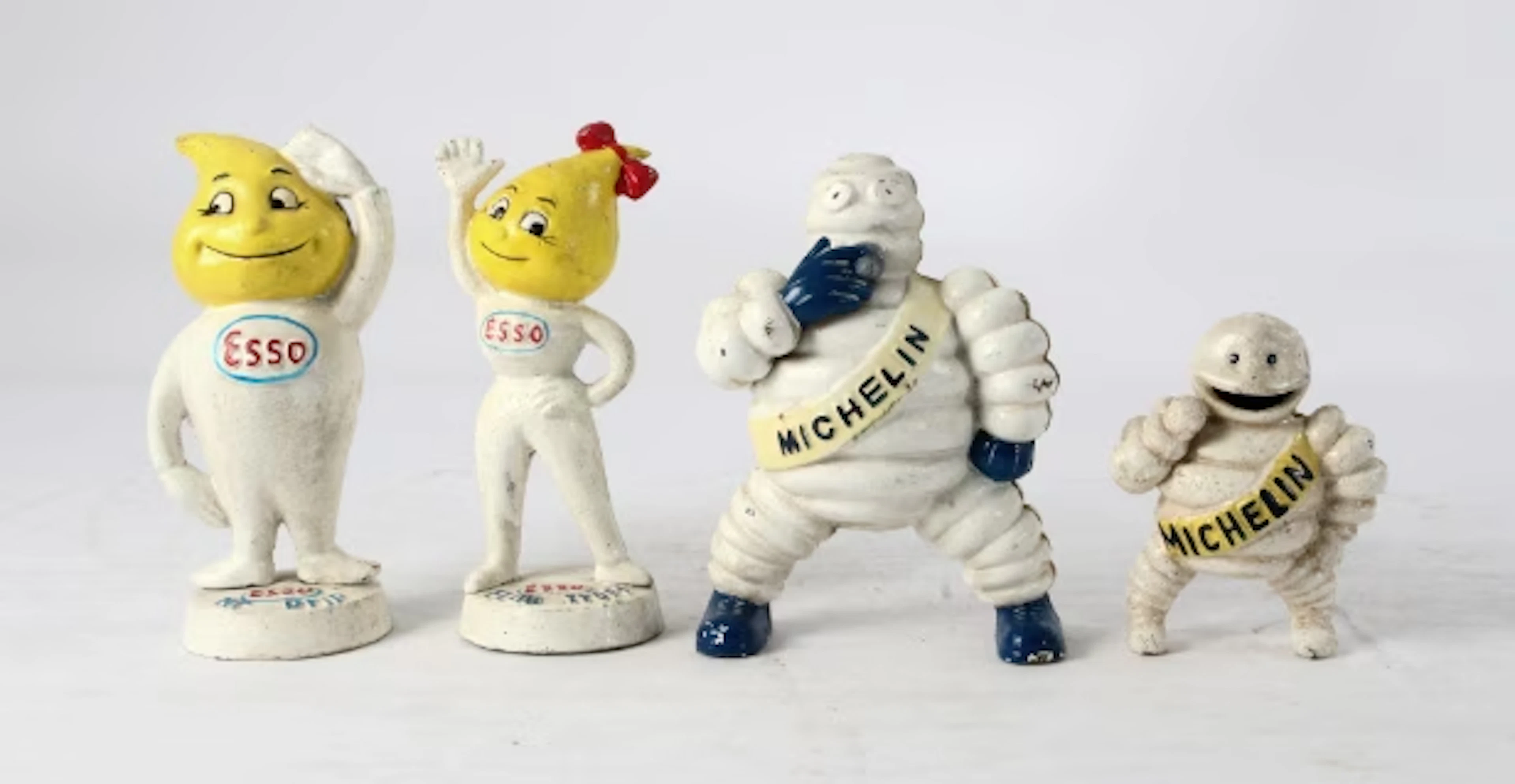 Cast iron money boxes / advertising figures (4)