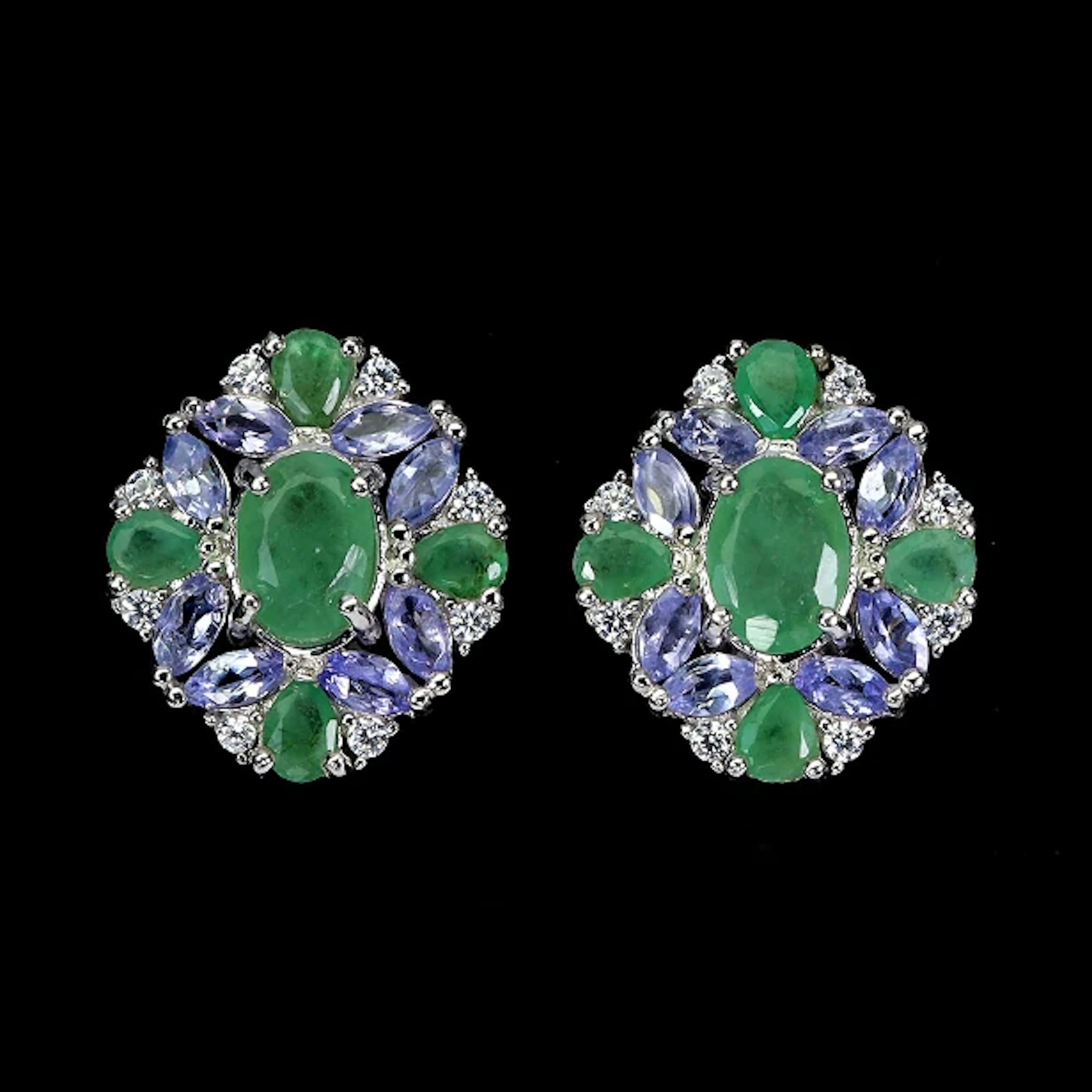 Earrings in rhodium-plated Sterling Silver adorned with numerous emeralds