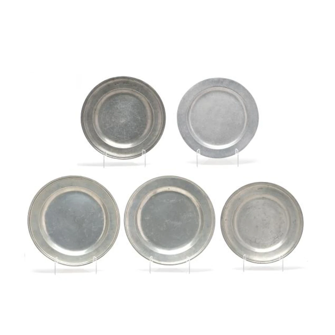 A Collection of Five Pewter and Metalware Chargers