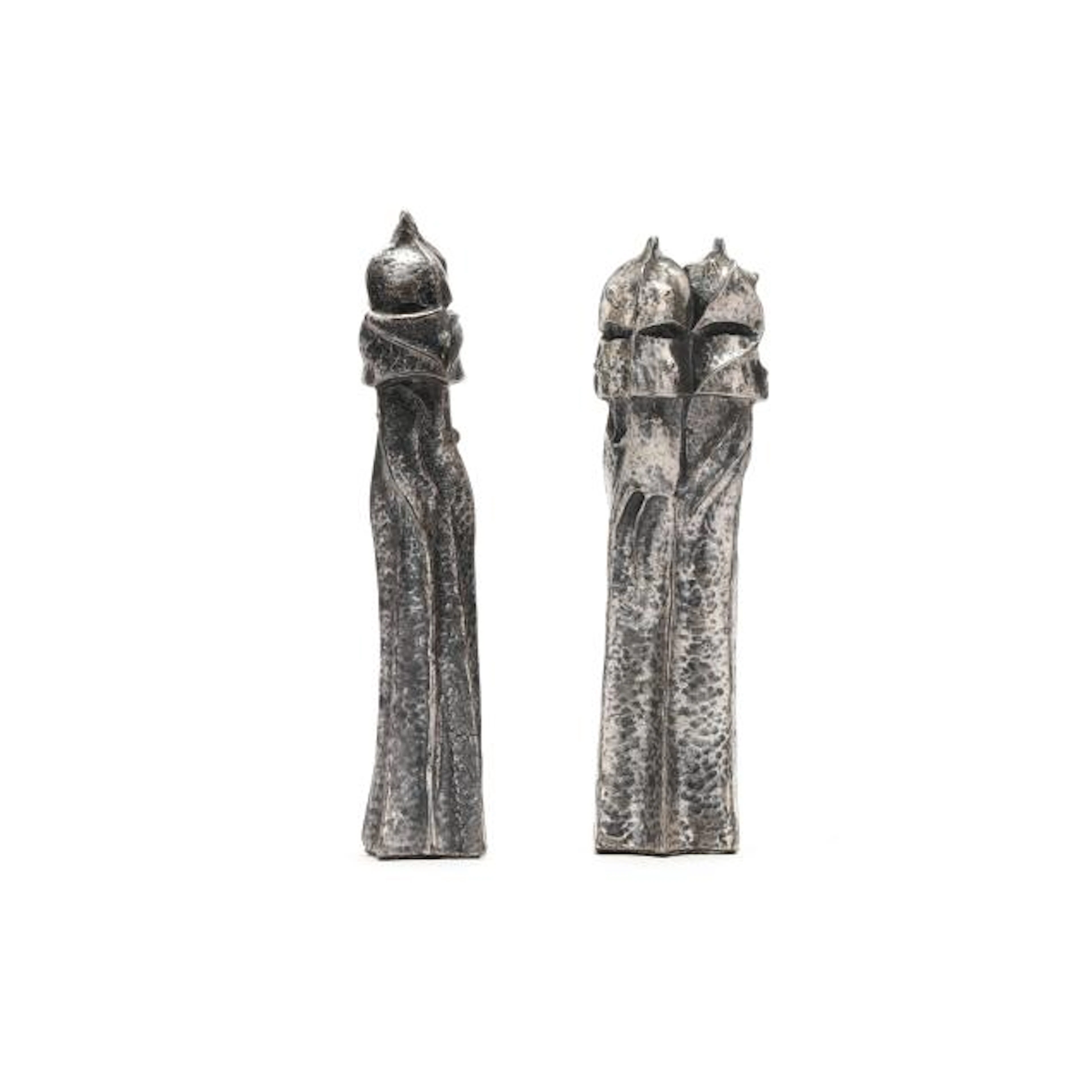 After Antoni Gaudi (Spanish 1852-1926), Two Silver-Plated "Warrior"
