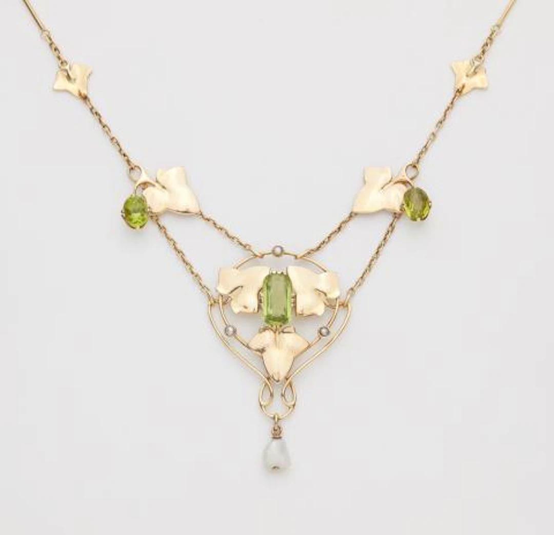 An English 15k gold pearl and peridot Liberty Style Arts & Crafts